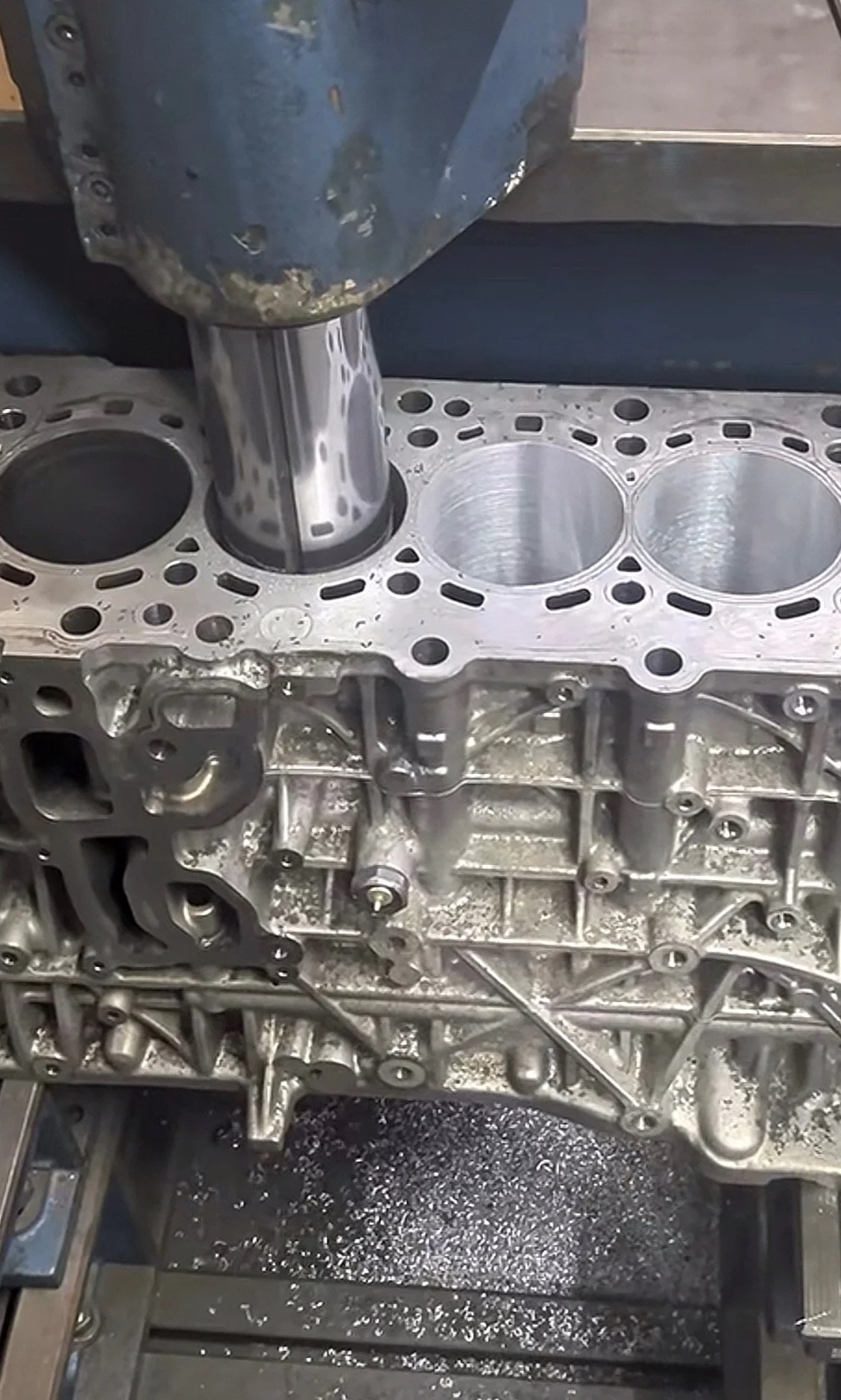 Engine block being machined on a CNC milling machine.