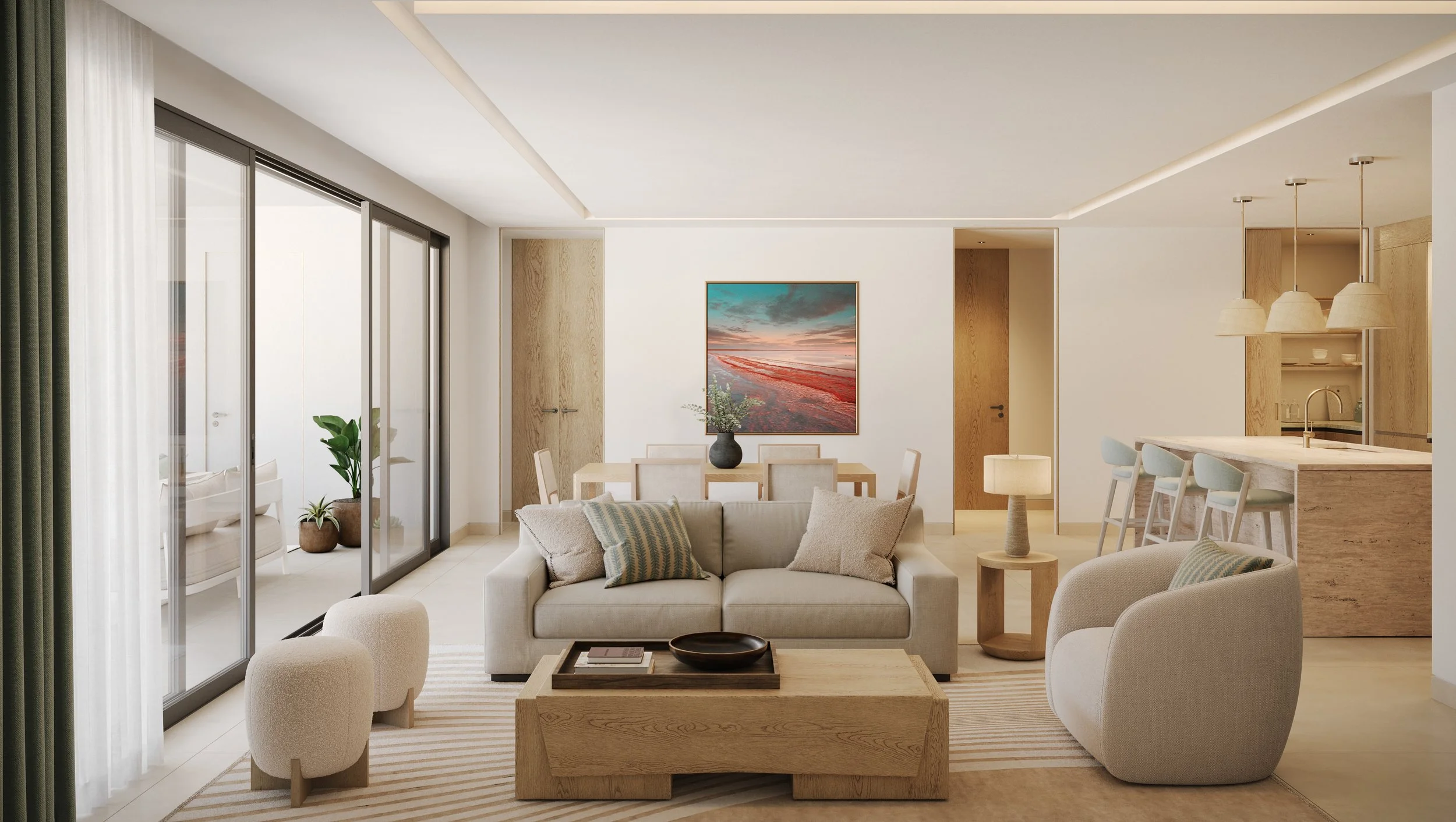 Living room with beige couches, a wooden coffee table, a dining table with chairs, and a kitchen area in the background. Large sliding glass doors lead to an outdoor space with potted plants, and there's a colorful landscape painting on the wall.