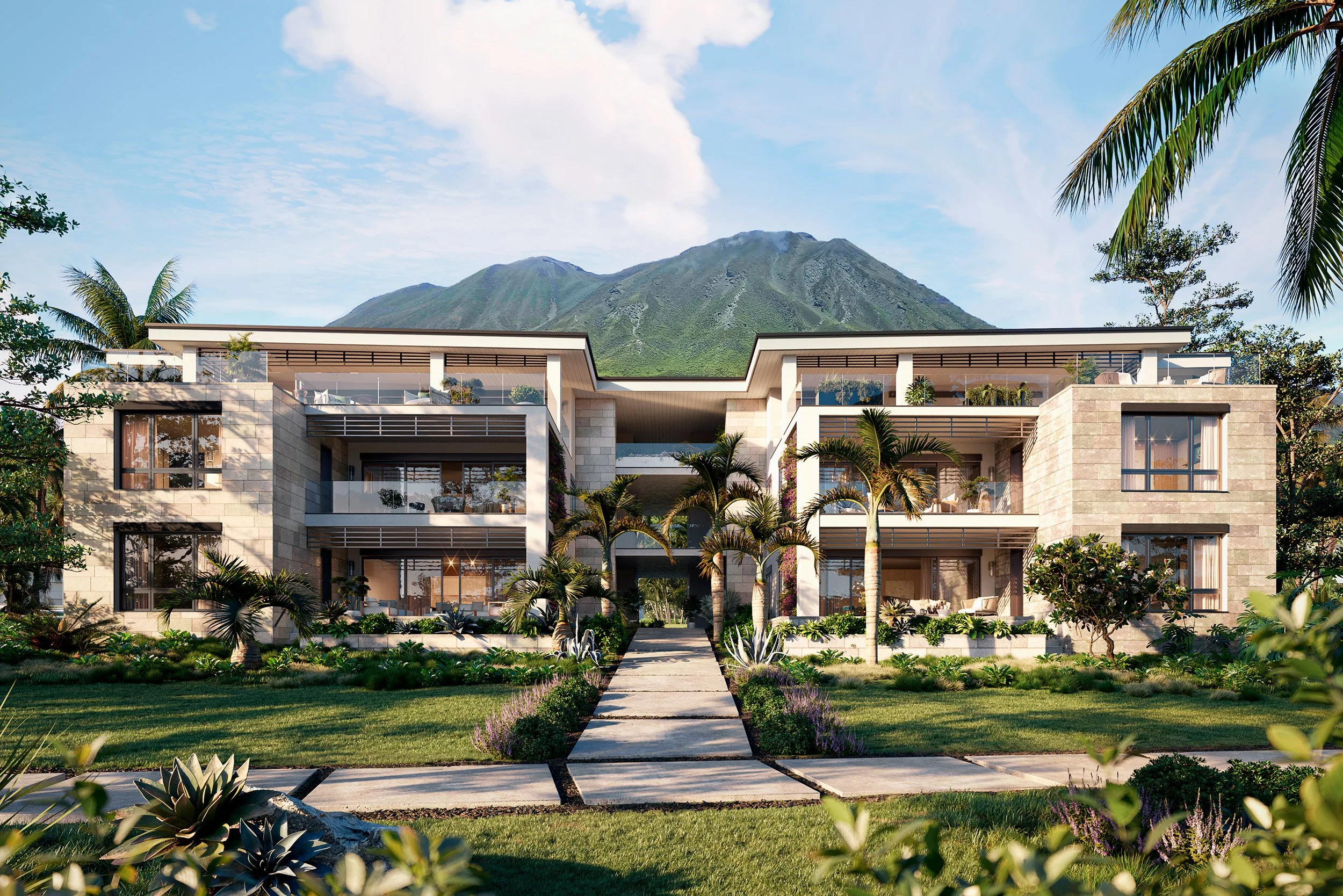 Modern multi-story residential building surrounded by lush greenery and palm trees with a mountain and blue sky in the background.