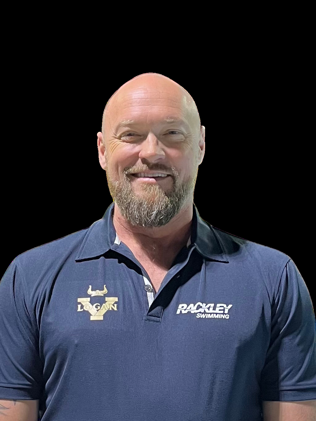 Man with a bald head and beard wearing a navy blue polo shirt with 'Logan' and 'Rackley Swimming' logos, smiling, against a black background.