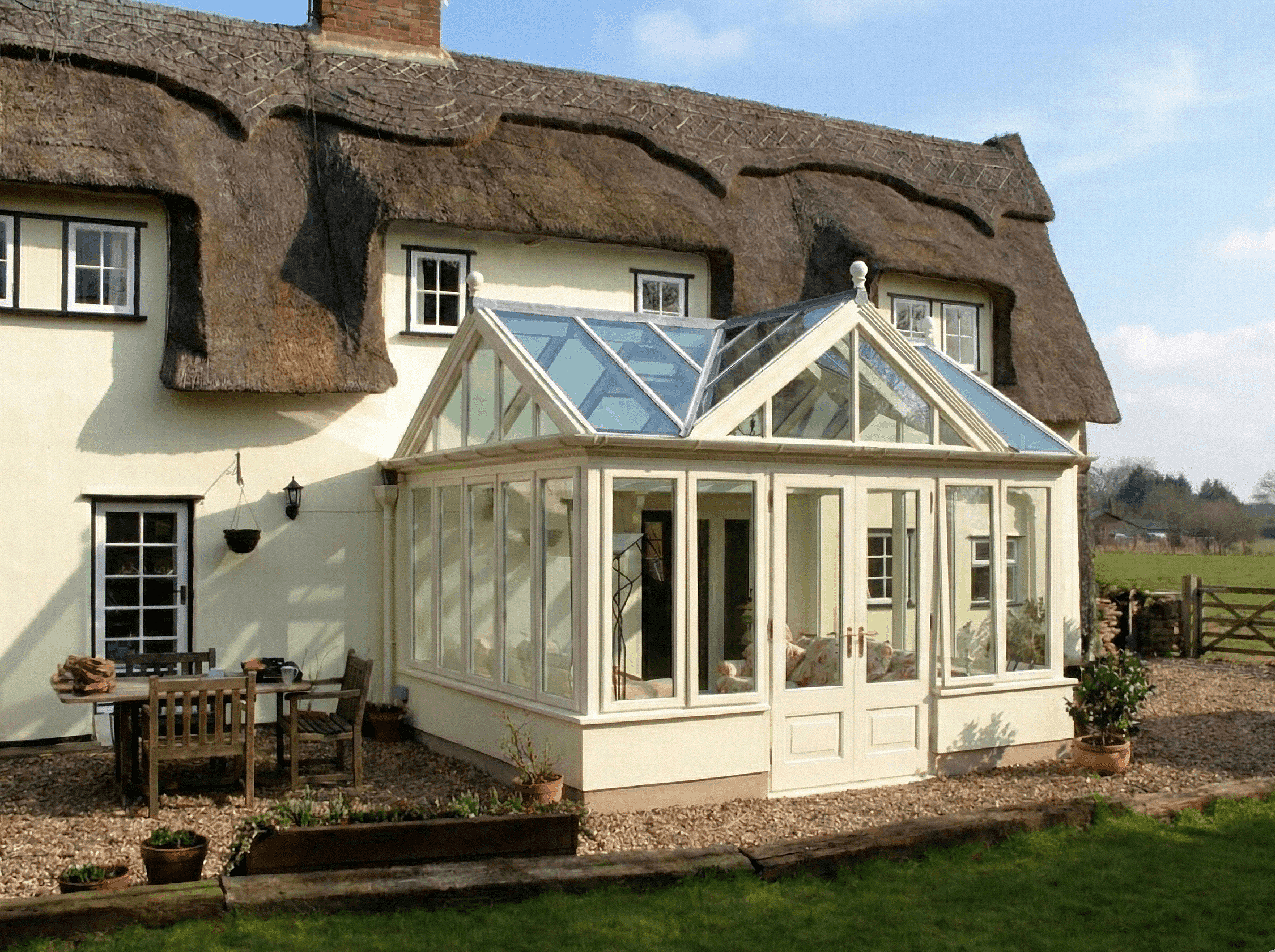 A classic timber conservatory featuring architectural joinery designed to complement a historic Bath stone home.