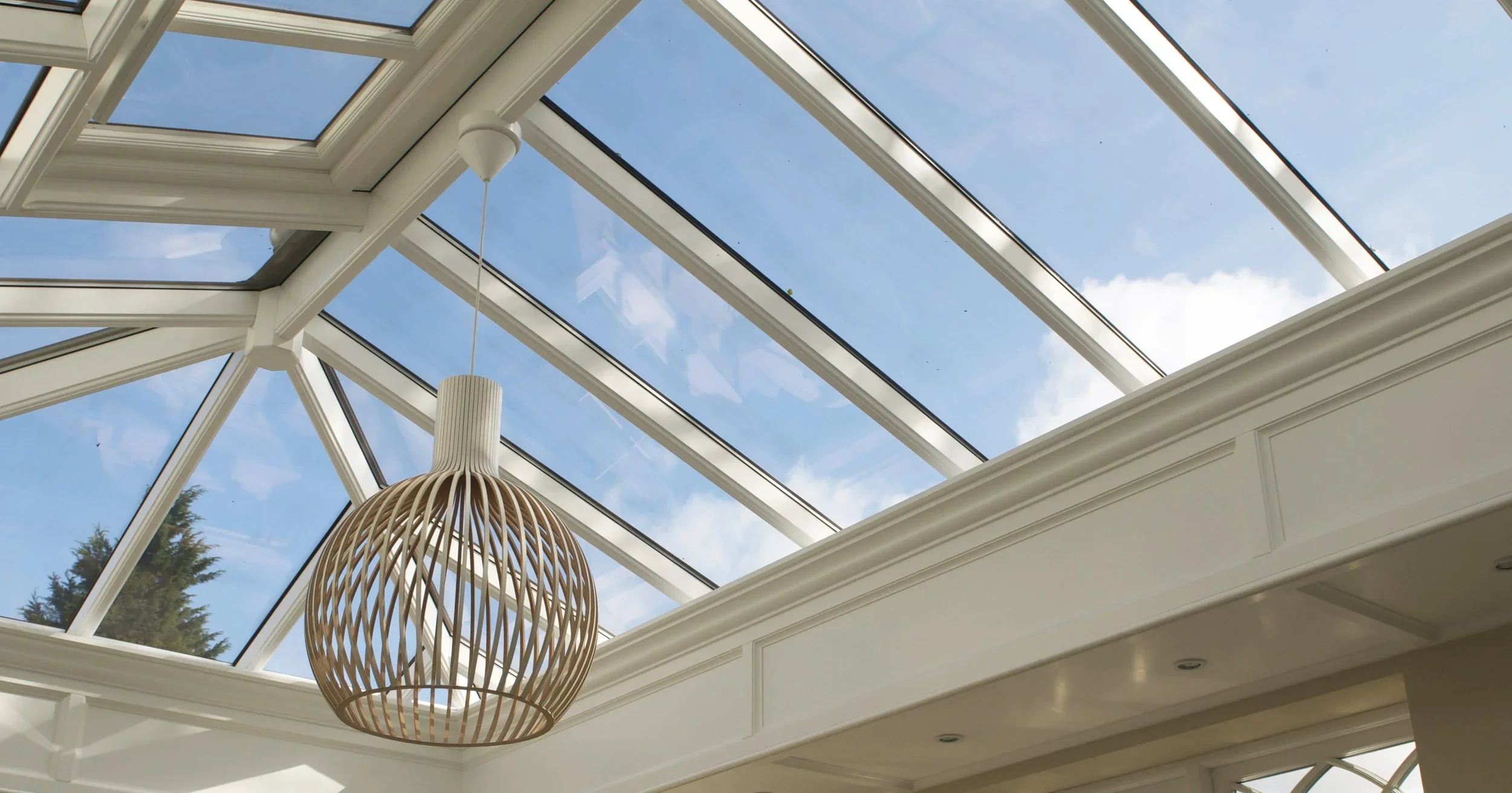 Detailed view of a precision-engineered hardwood roof lantern, providing exceptional natural light and sky views.