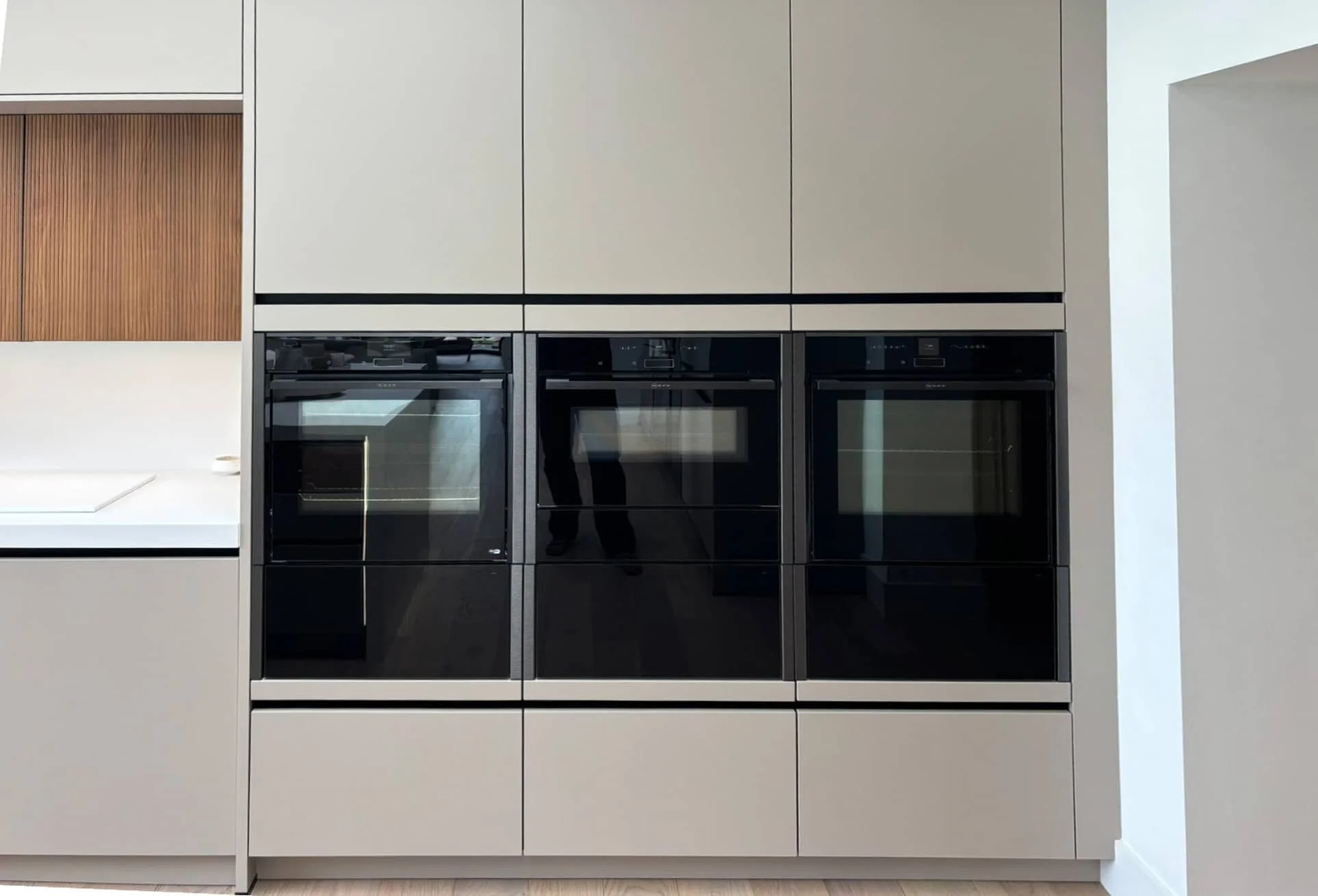 Modern Häcker Systemat kitchen in fluted walnut with brushed bronze island -IMG_5145-2000x1500_edited.jpeg