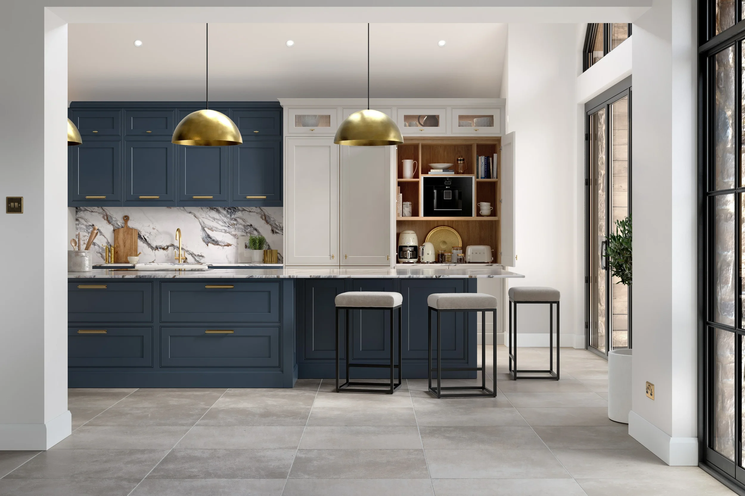 Modern kitchen with blue and white cabinetry, gold accents, marble backsplash, and seating area with three barstools. Large windows and glass door let in natural light.