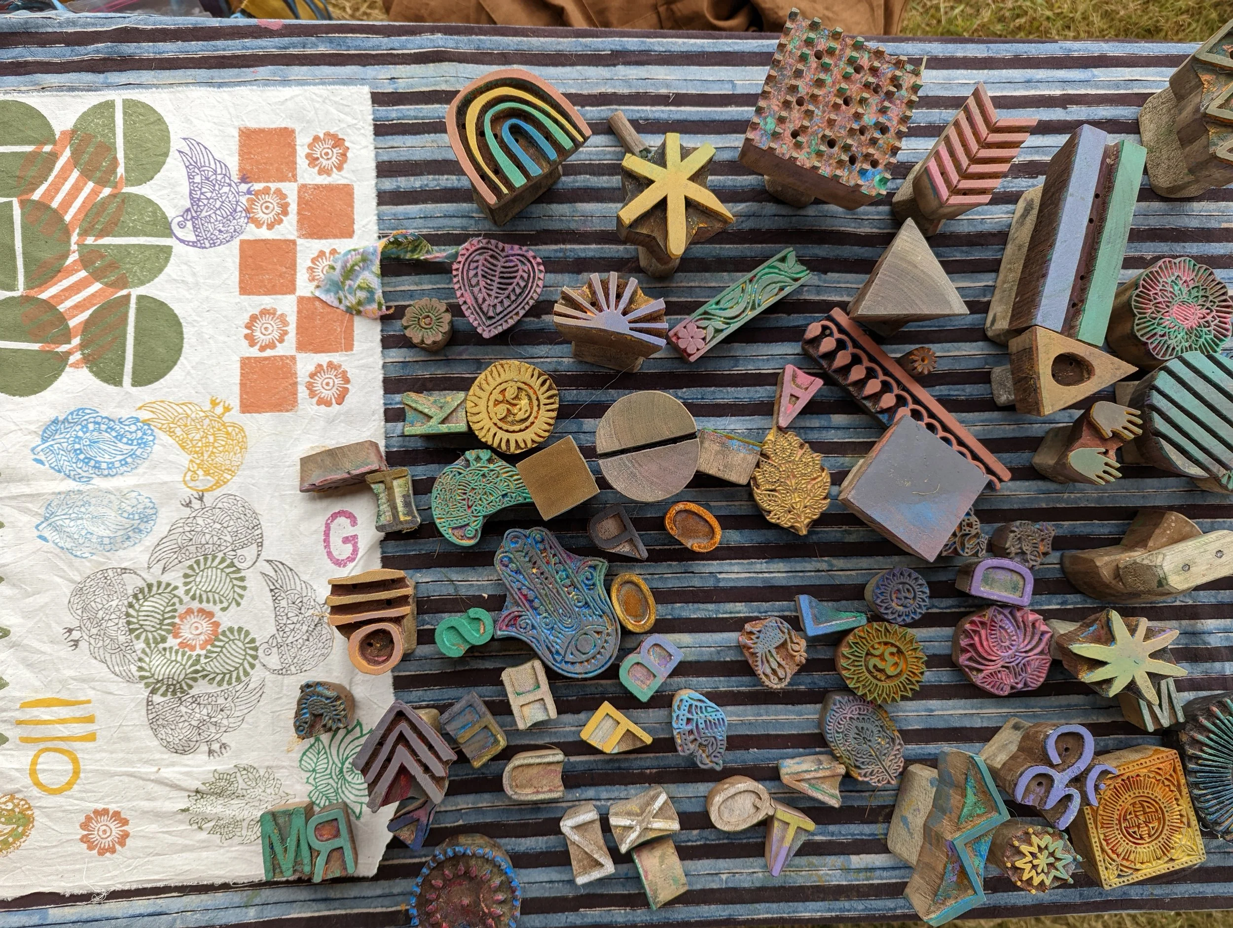 Various colorful rubber stamps with different shapes and designs. used in studio om block printing workshops
