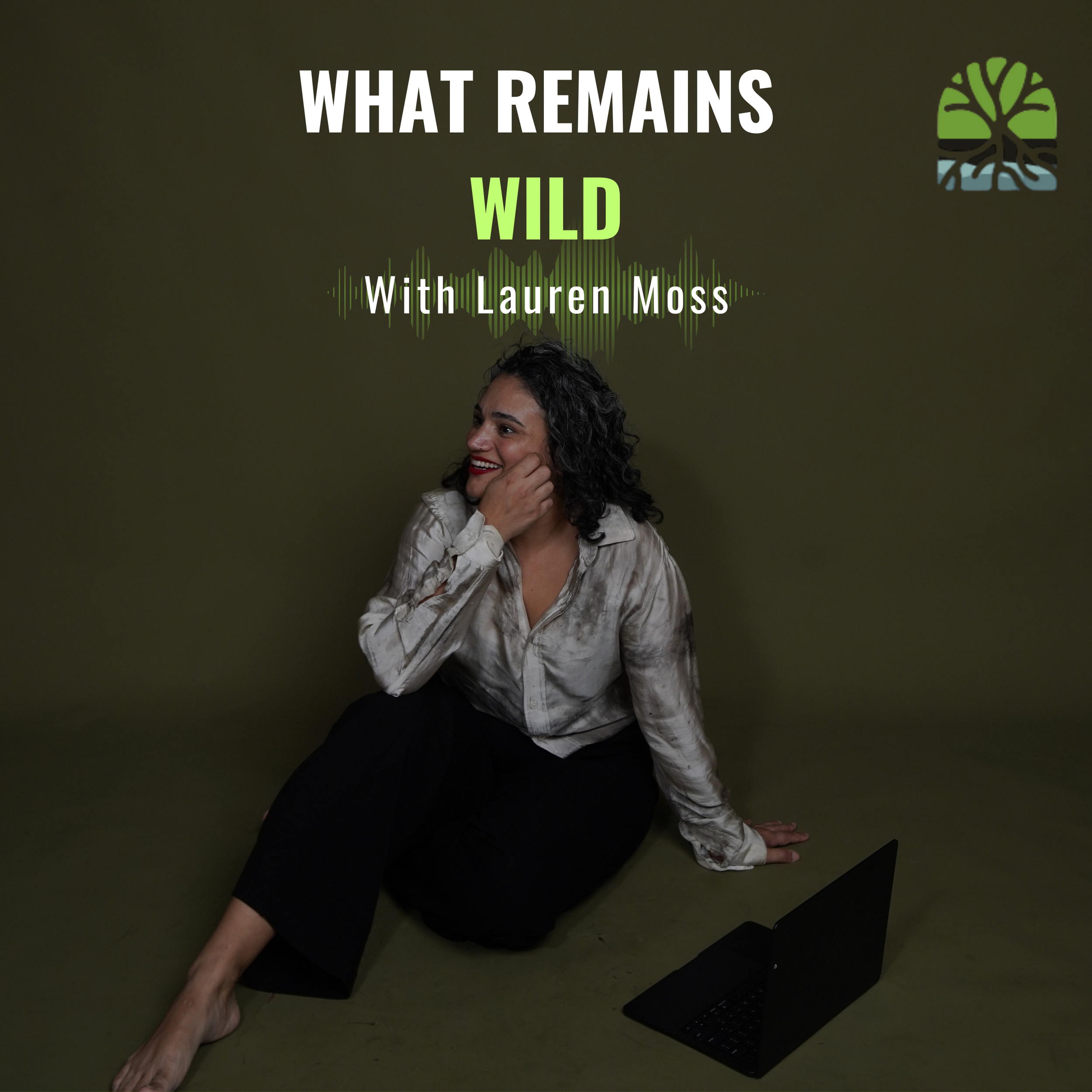 Lauren in a bush dyed shirt over black pants, sitting on the floor with her laptop and the words "What Remains Wild with Lauren Moss"