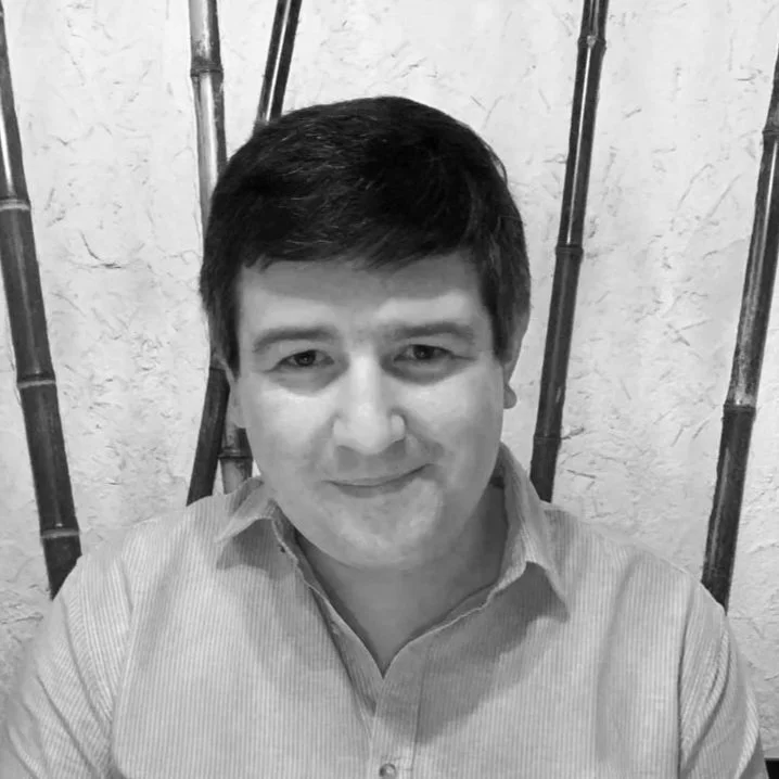 Black and white portrait of a young man in a suit and tie