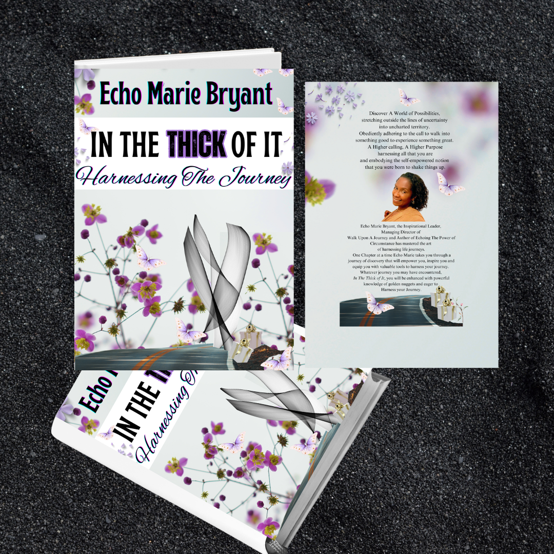 A paperback book titled 'In the Thick of It: Harnessing The Journey' by Echo Marie Bryant, placed on a black textured surface, with an open book showing a continuation of the cover design featuring purple flowers, butterflies, and a feather.