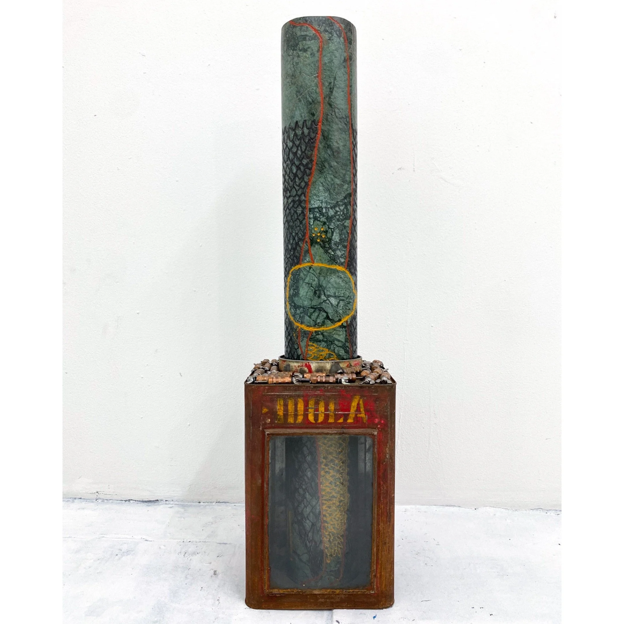 ‘Don’t Look Down’, 9.25in x 9.25in x 36.25in, Engraved green marble painted with natural pigments and walnut oil, military wing nut draw fasteners, and a metal Indonesian candy box.