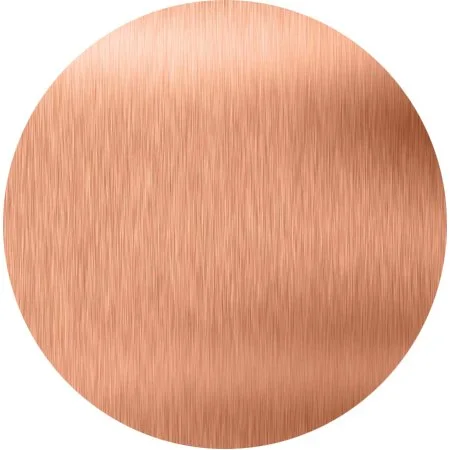 Close-up of a round copper surface with a brushed finish.