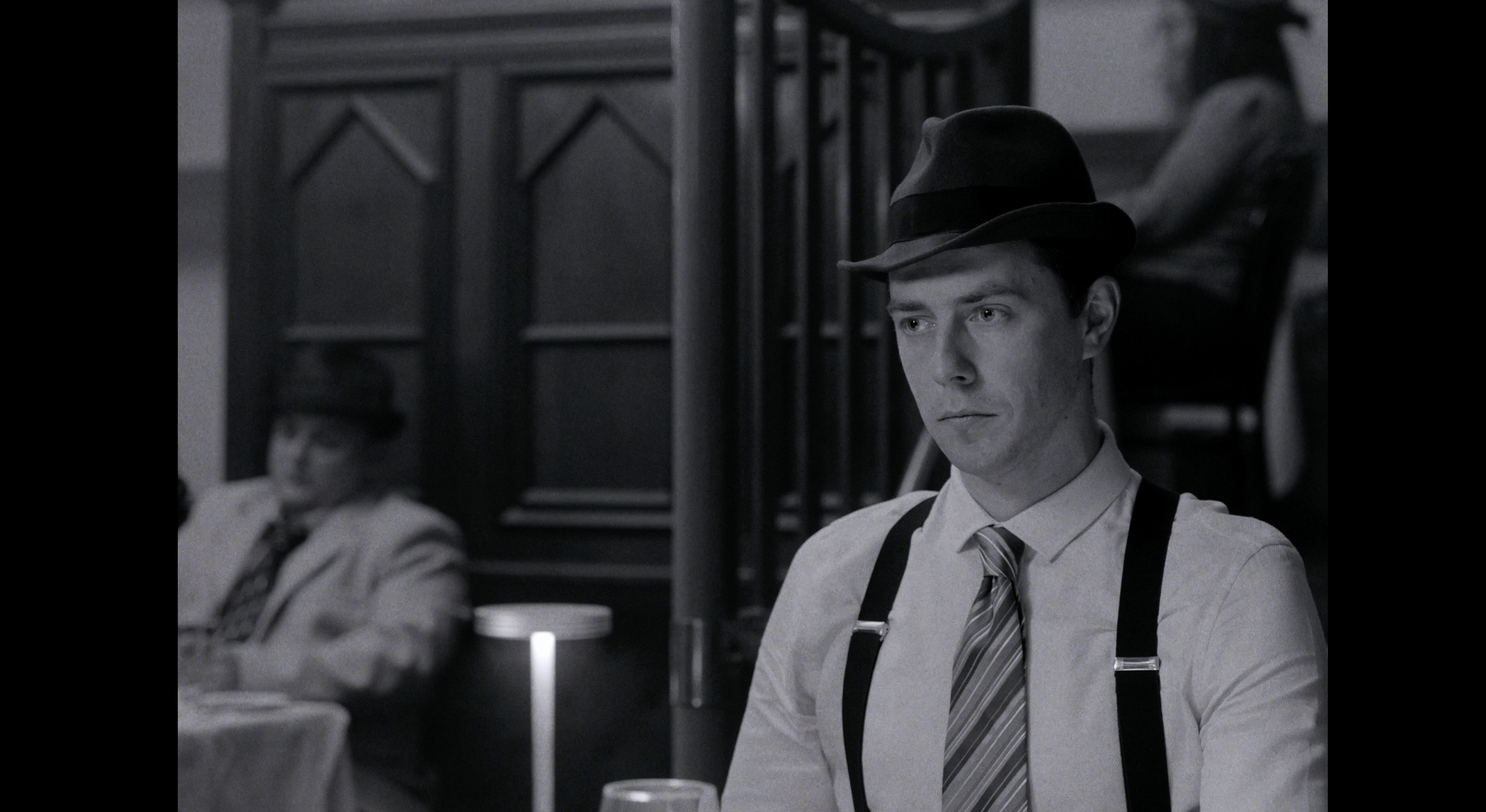 Copy of Mike - sitting at table B&W.png