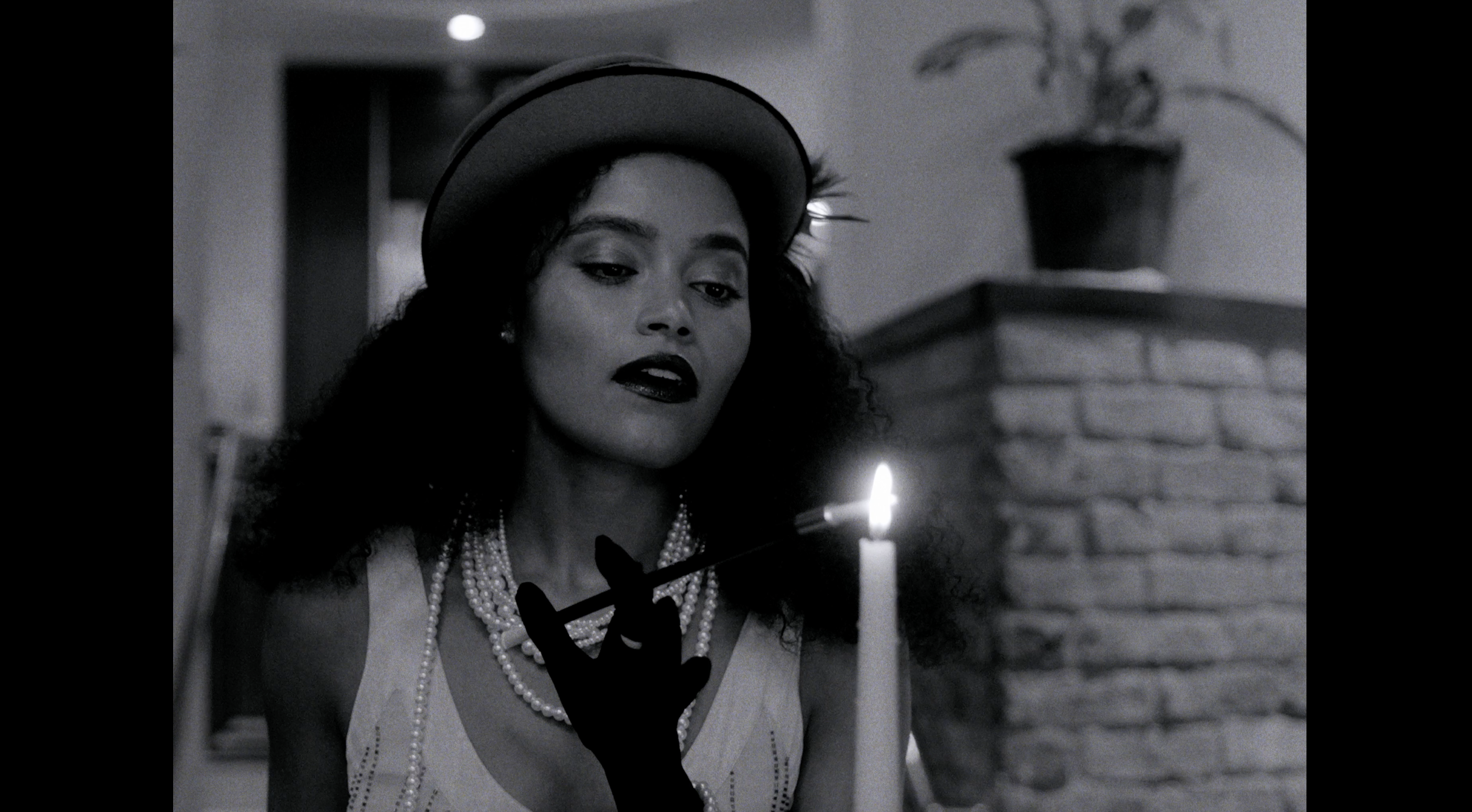 Copy of Lara - lighting cig, B&W 2.png