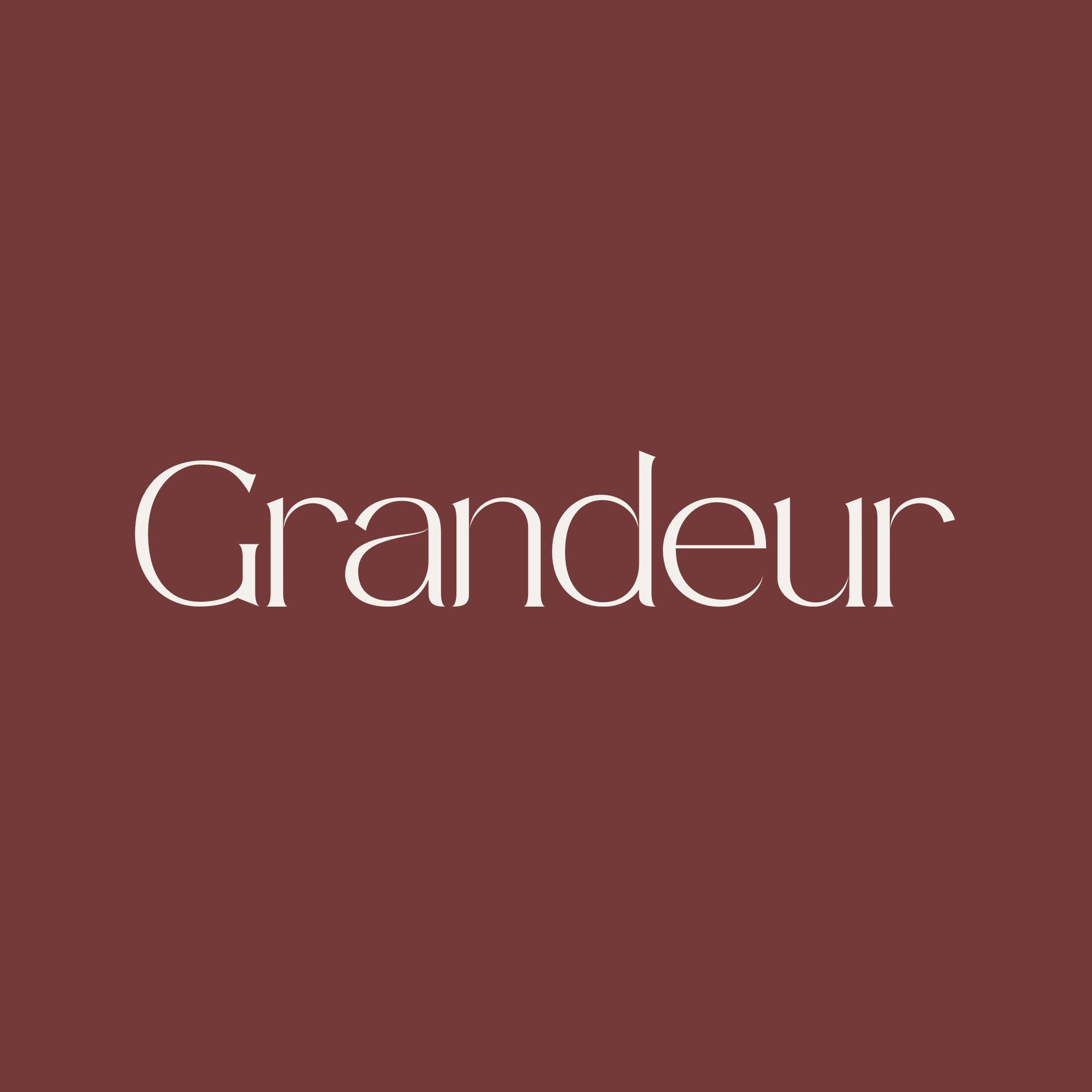 Close-up of a dark red background with large white text that reads 'Grandeur'.