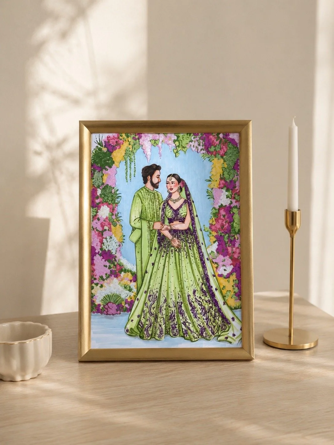 A framed fashion illustration of a bride and groom