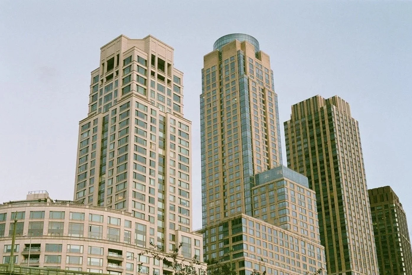 High-rise office buildings with glass windows in a cityscape.