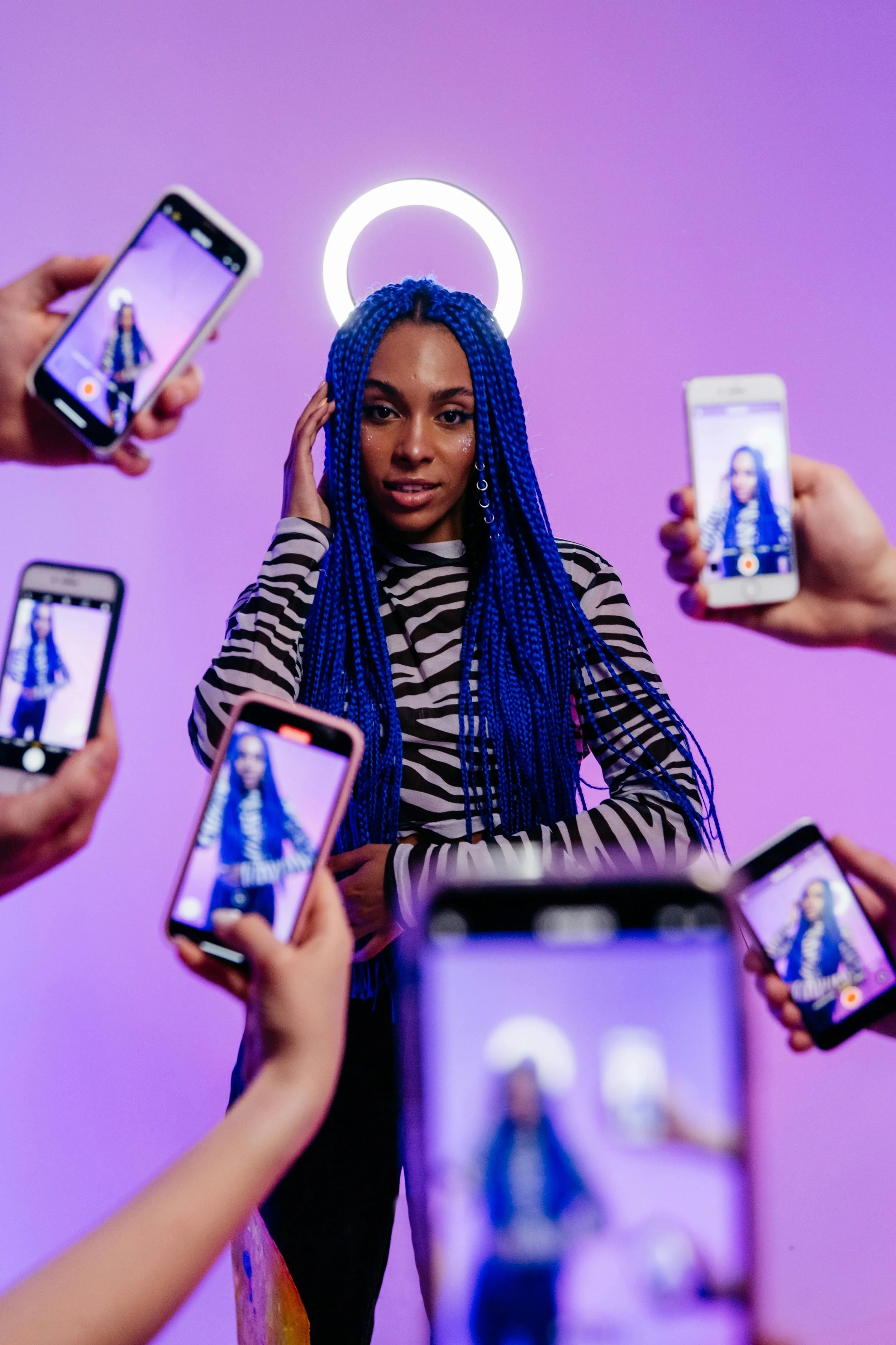 Image of a social media influencer having a photoshoot, surrounded by paparazzi taking her photo - with the words "brand management in Doncaster & manchest" overlayed ontop of the image