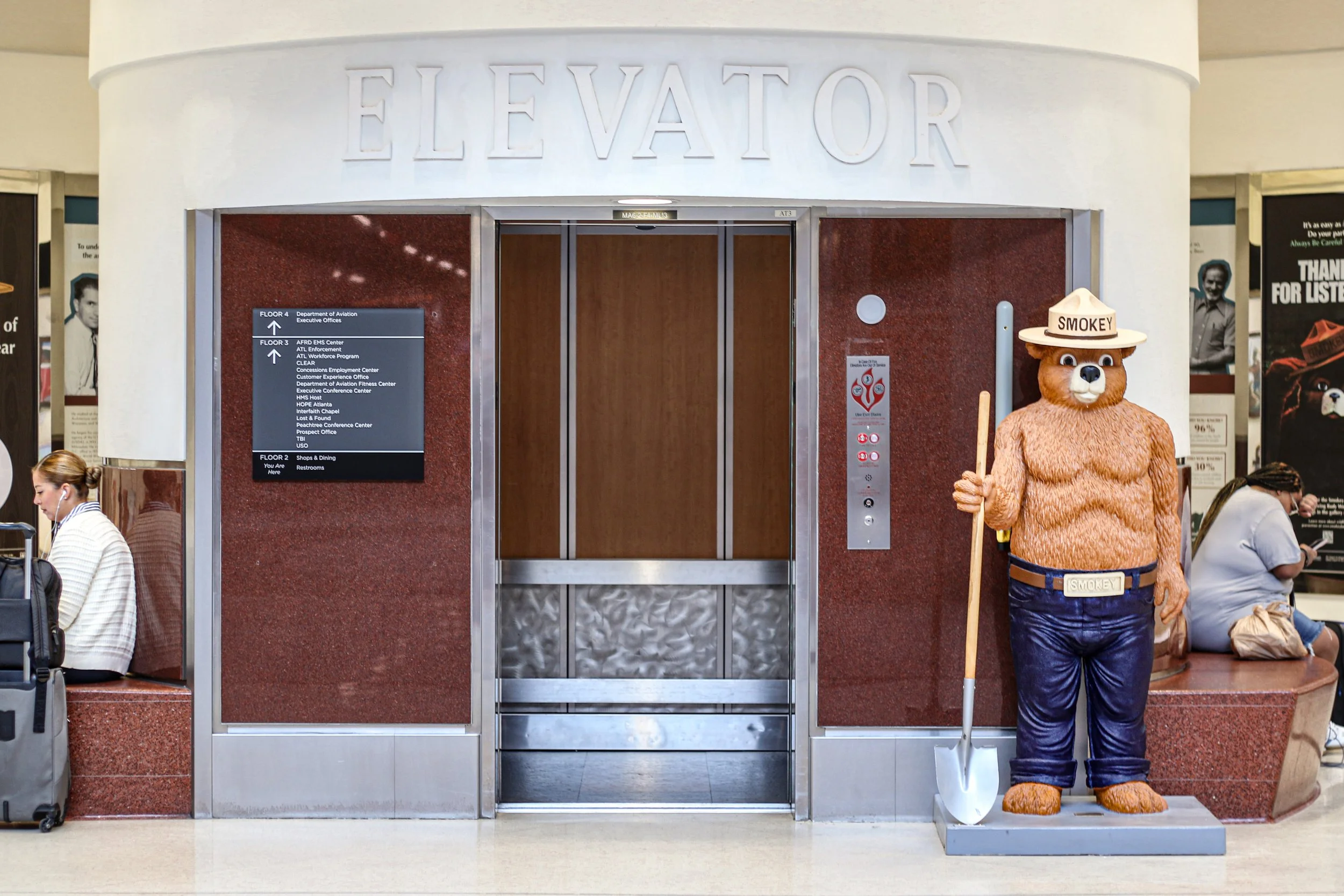 Elevator with 2026 FIFA World Cup wall decals on exterior inside the Hartsfield-Jackson Atlanta International Airport.