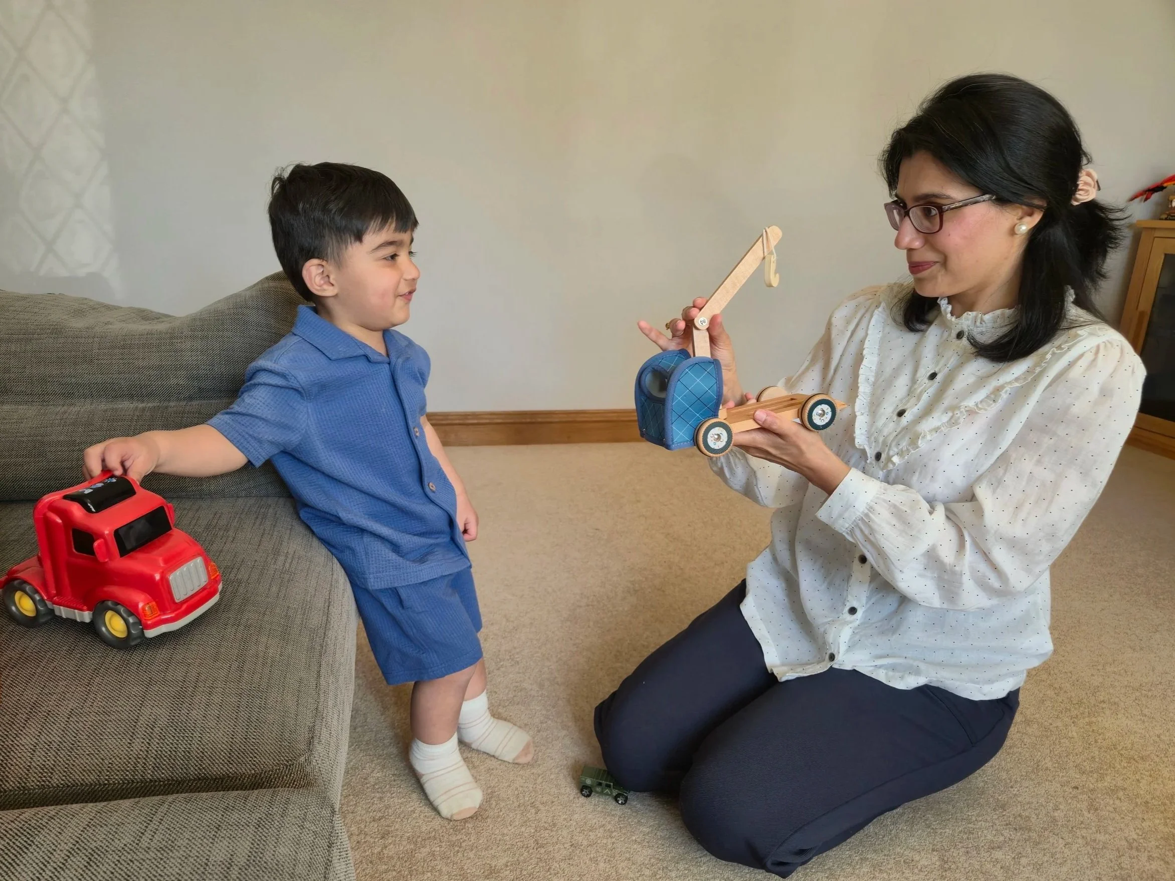 Rabab Sehr (Speech therapist) engages in customized play based speech therapy activity with a child suffereing from speech delays. 