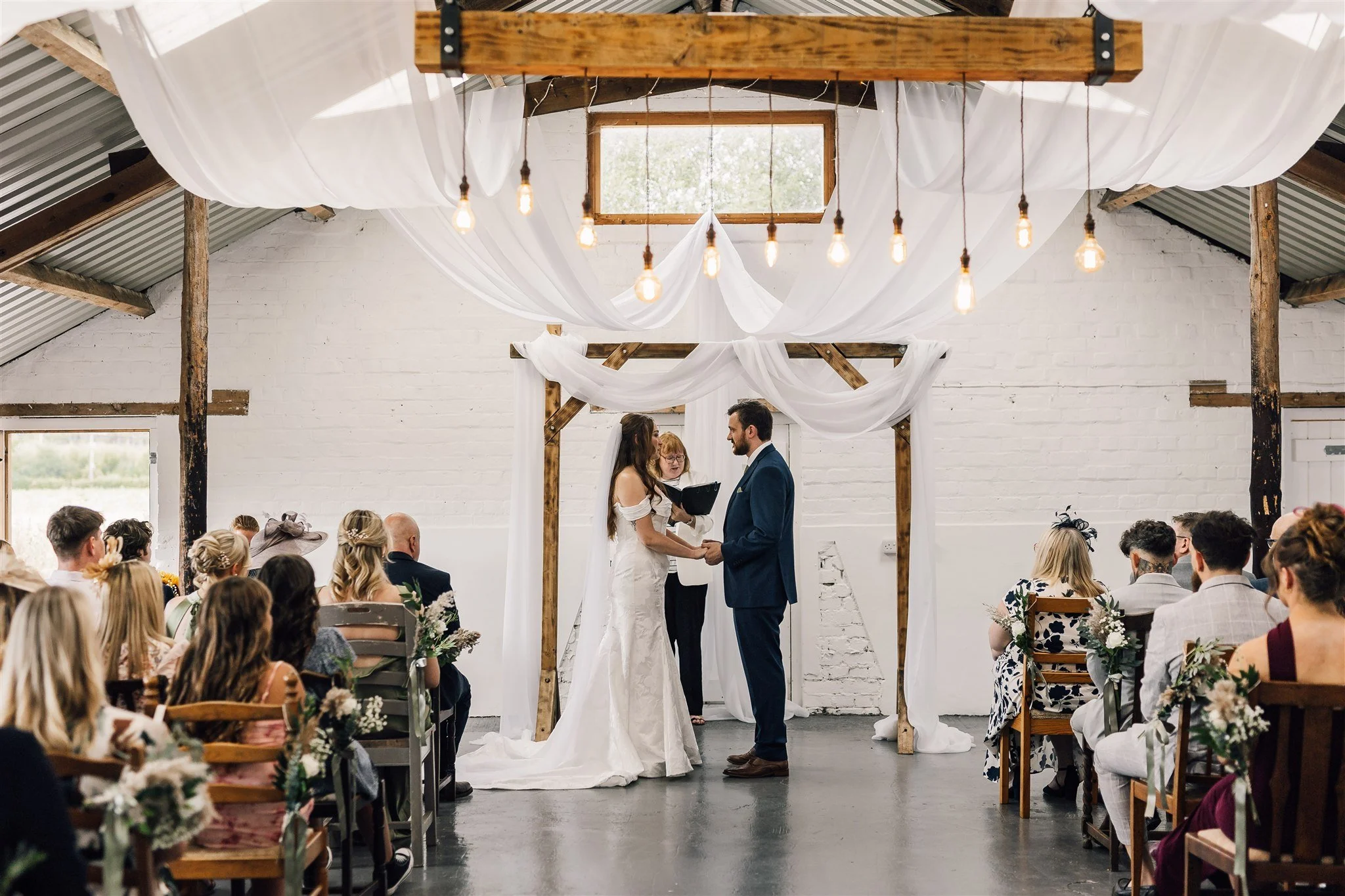 Bride and Groom during Ceremony inside the piggery white Syke fields
