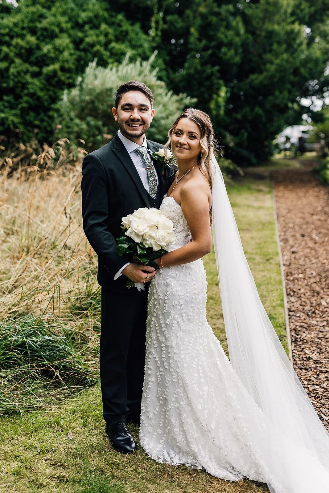 Charlotte and Rory together in the gardens after their ceremony