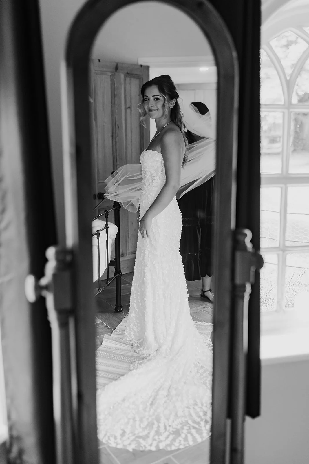 Black and white bridal portrait of Charlotte indoors