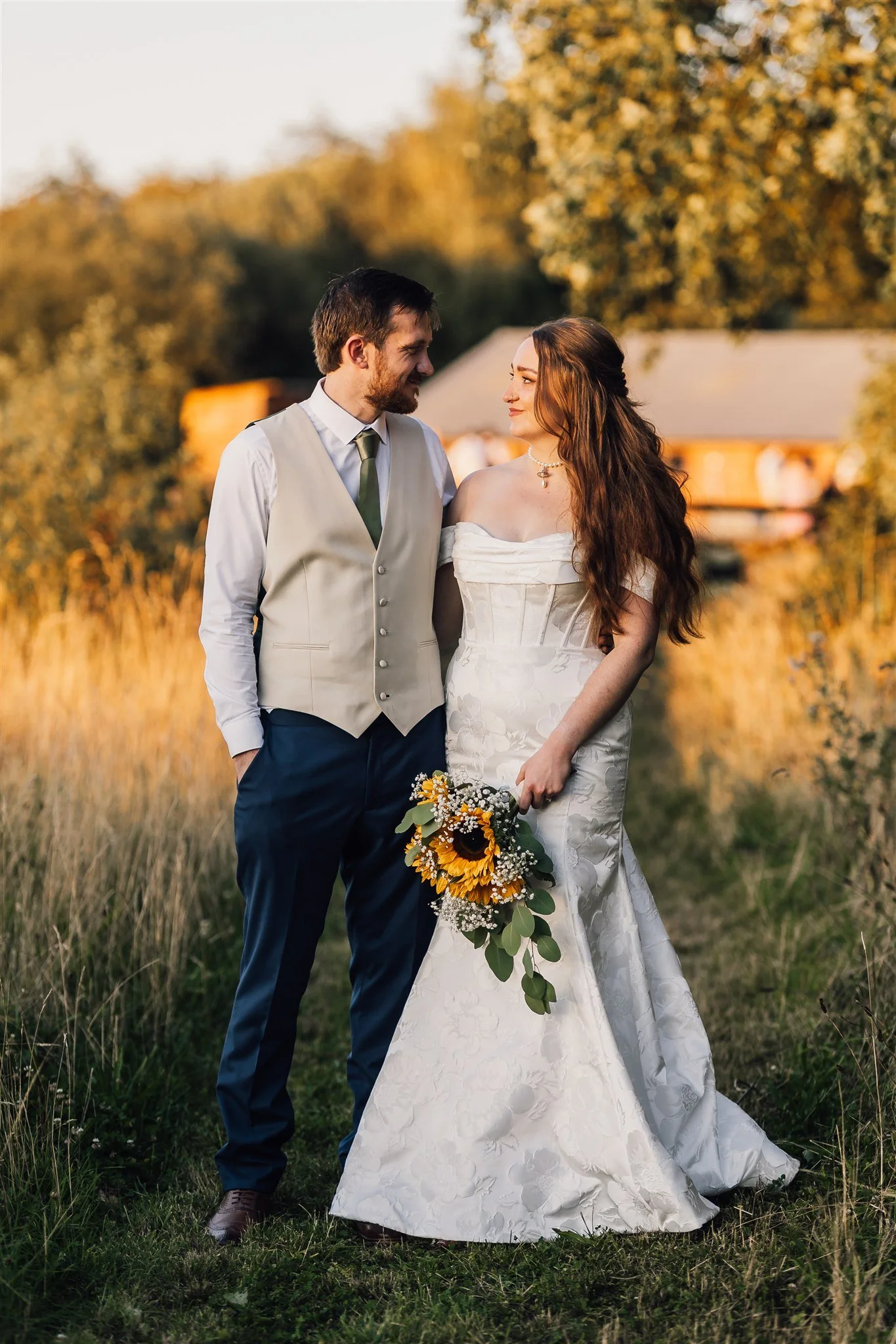 Bride and groom during sunset in a field at White Syke Fields