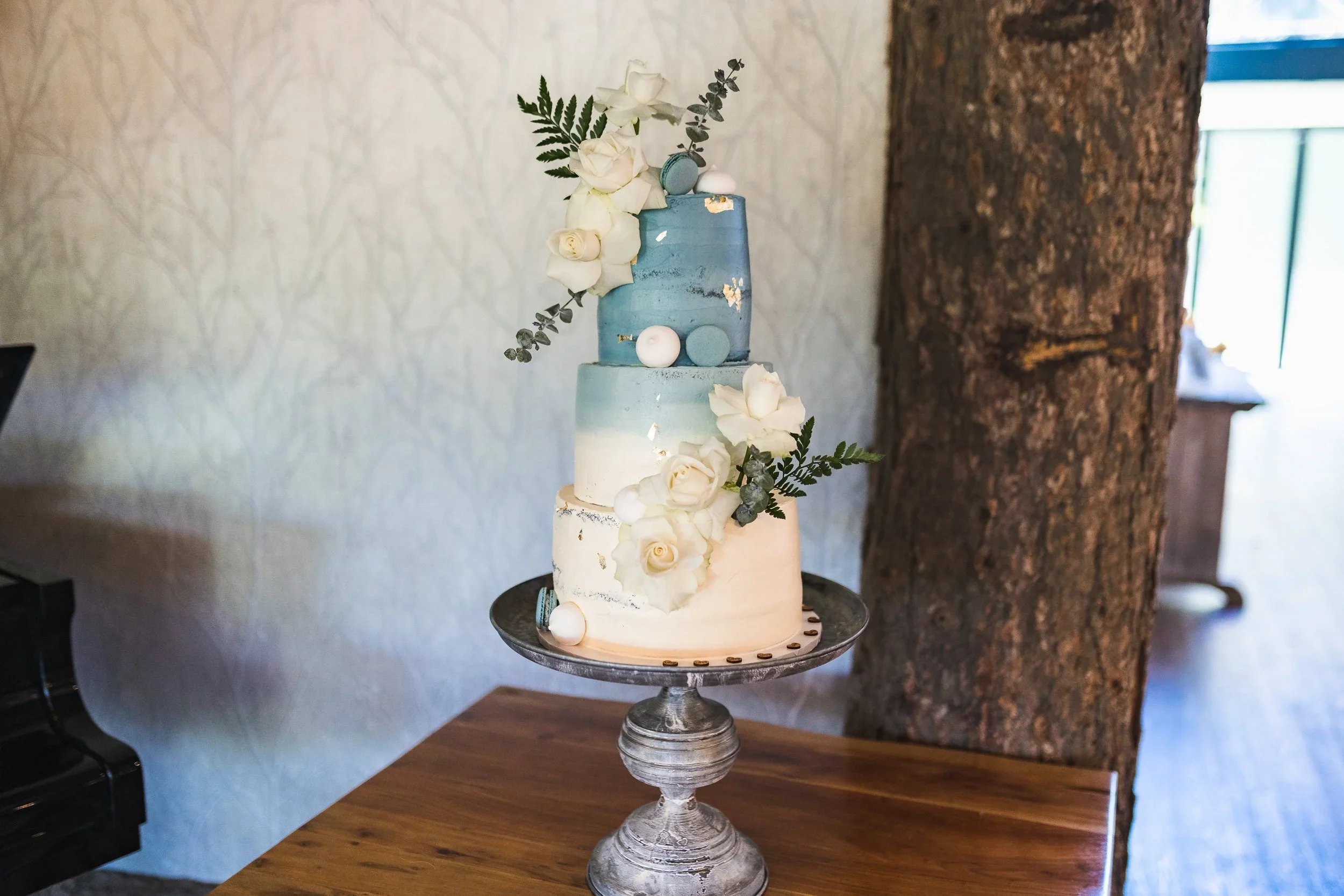 Three tier wedding cake displayed inside Oaklands Grand Lodge wedding venue in Driffield, East Yorkshire