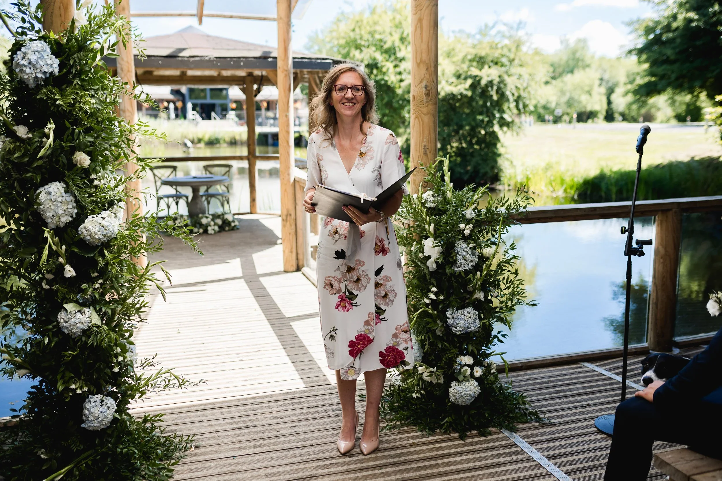 Celebrant conducting an outdoor wedding ceremony at Oaklands Grand Lodge lakeside pavilion in Driffield.