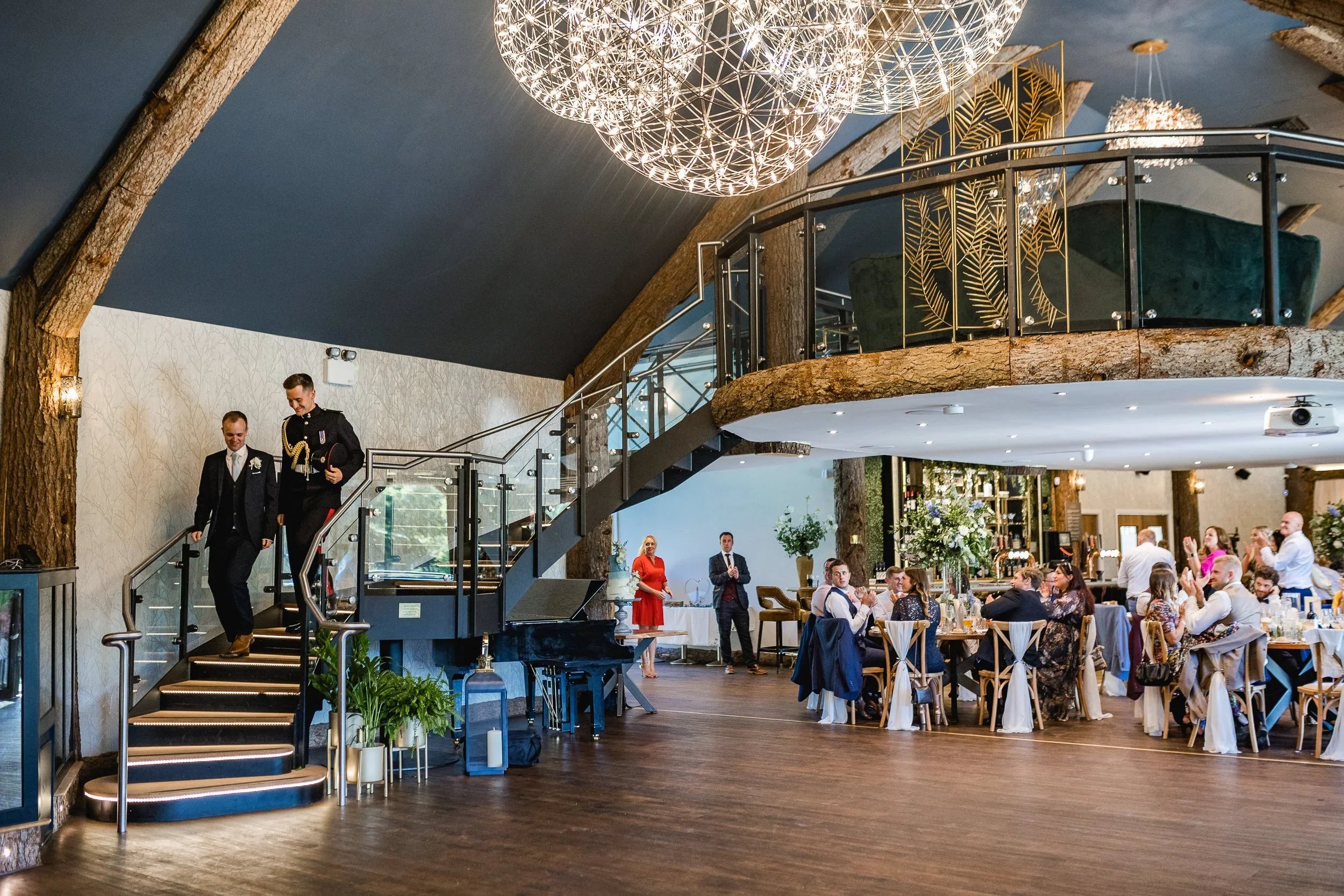 Grooms entering the reception room at Oaklands Grand Lodge in Driffield during their wedding celebration.