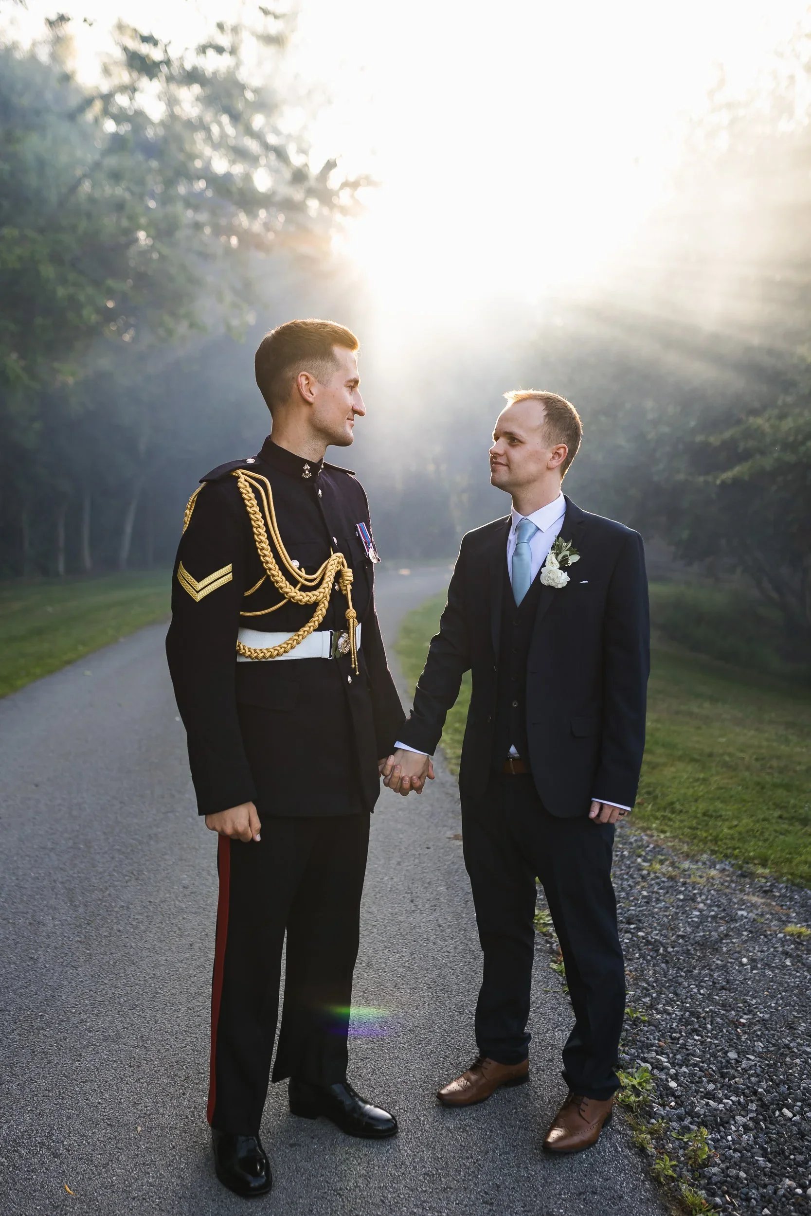 Same sex couple portrait walking through the grounds at Oaklands Grand Lodge wedding venue in Driffield
