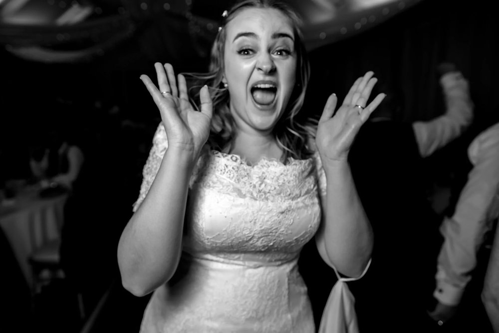Georgia singing on the dance floor at her Thorner Victory Hall wedding