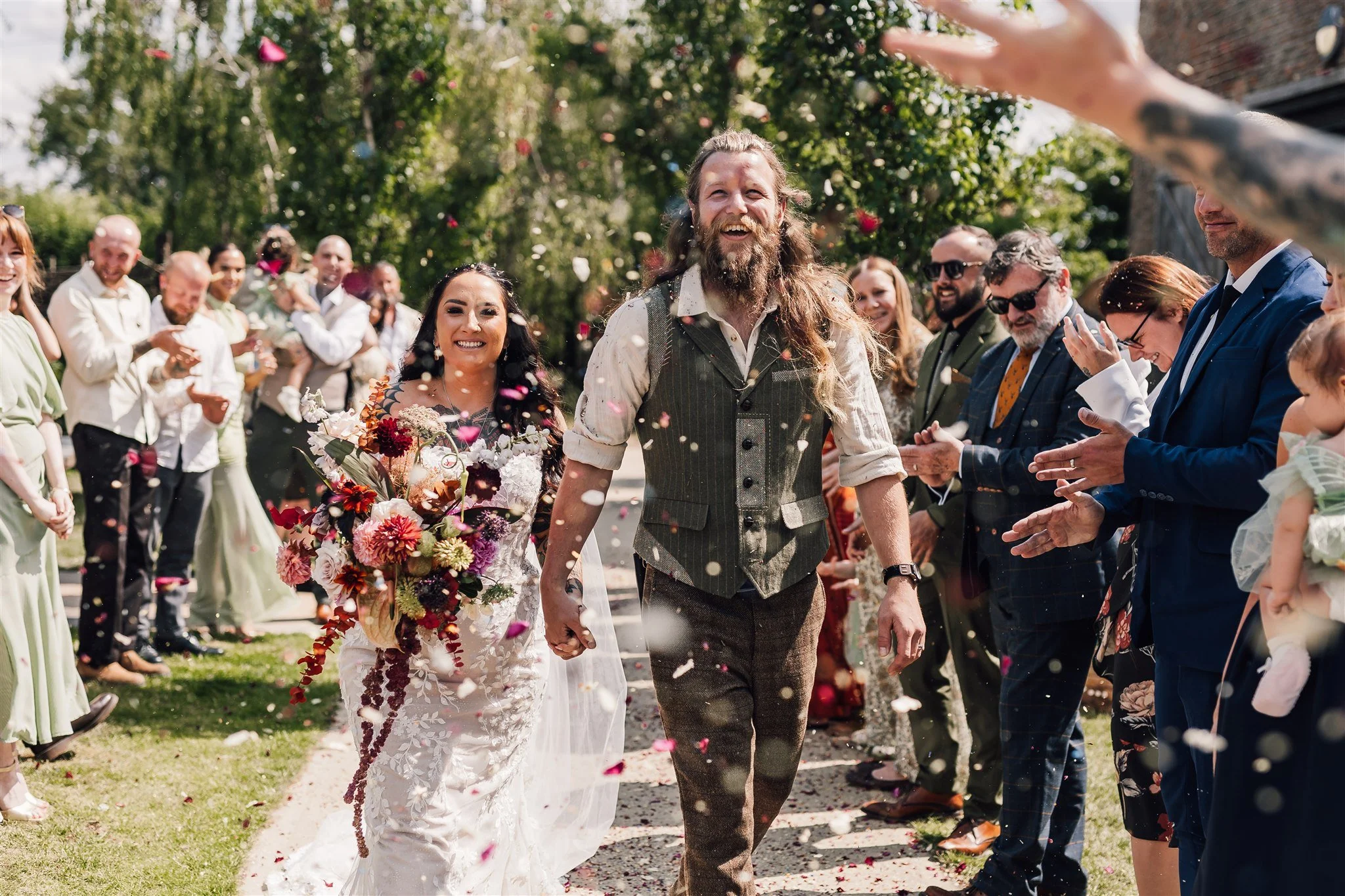 Riverlands Wedding Couple Walking Through Confetti