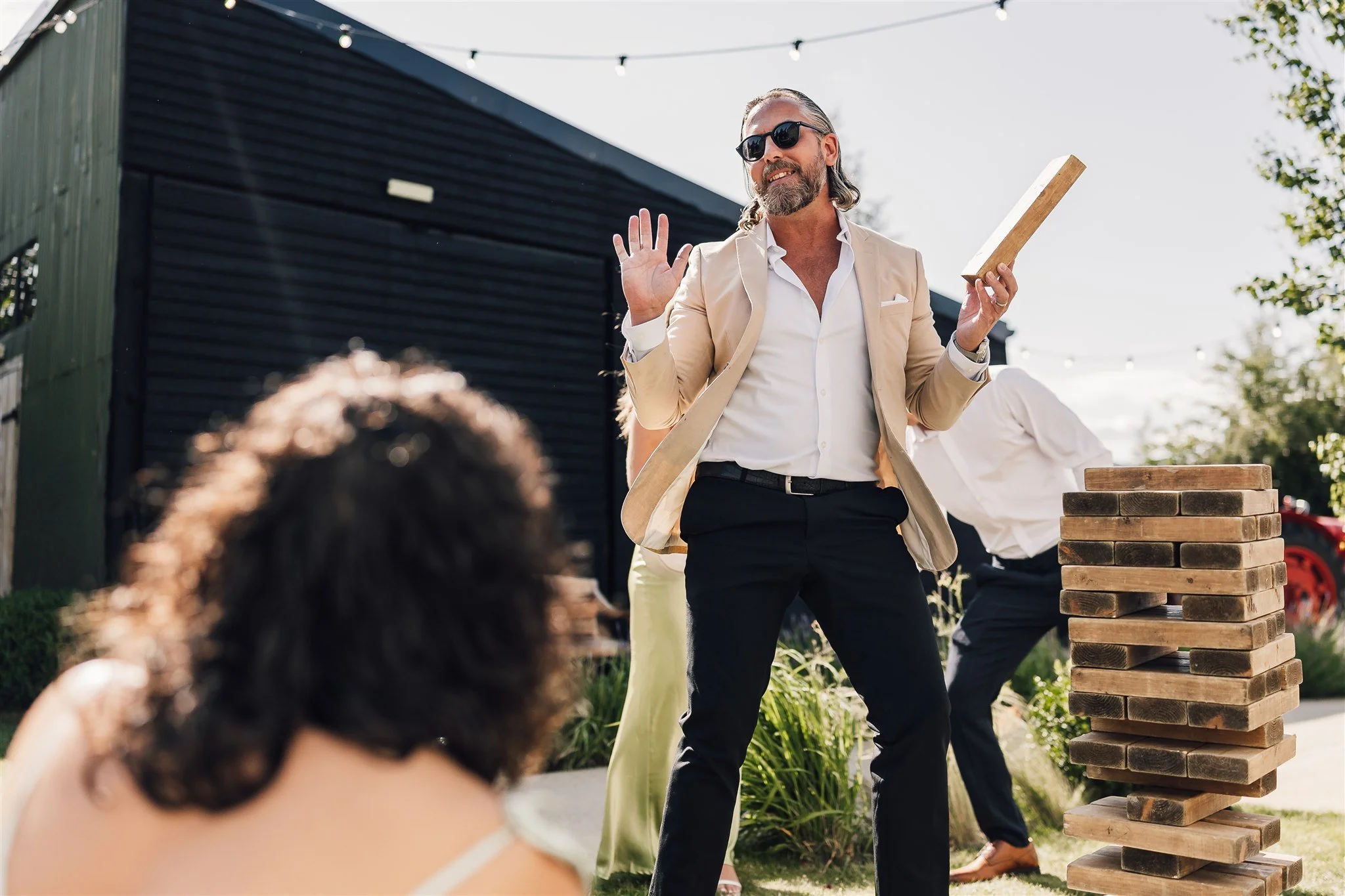 Wedding Guest Playing Giant Jenga Garden Game