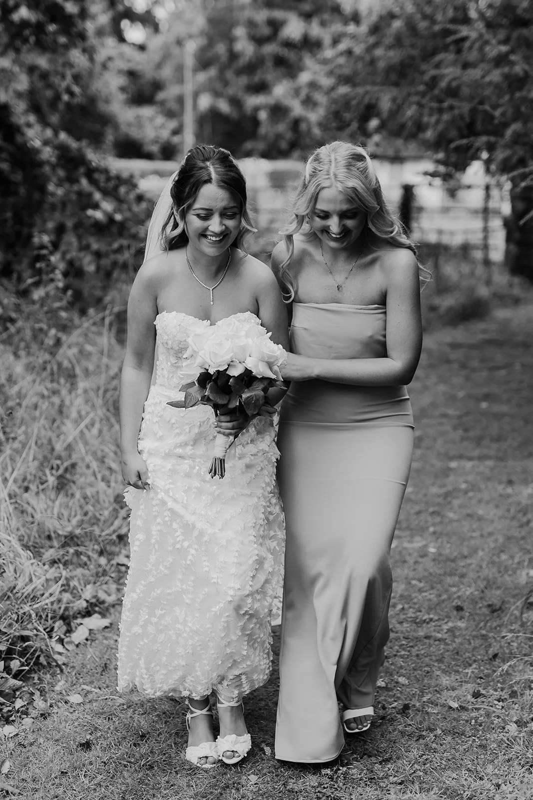 Black and white photograph of Charlotte with a loved one before the ceremony