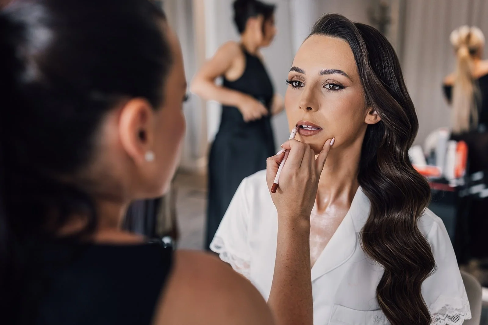 Becky having her makeup finished before her wedding at The Barn at Willerby