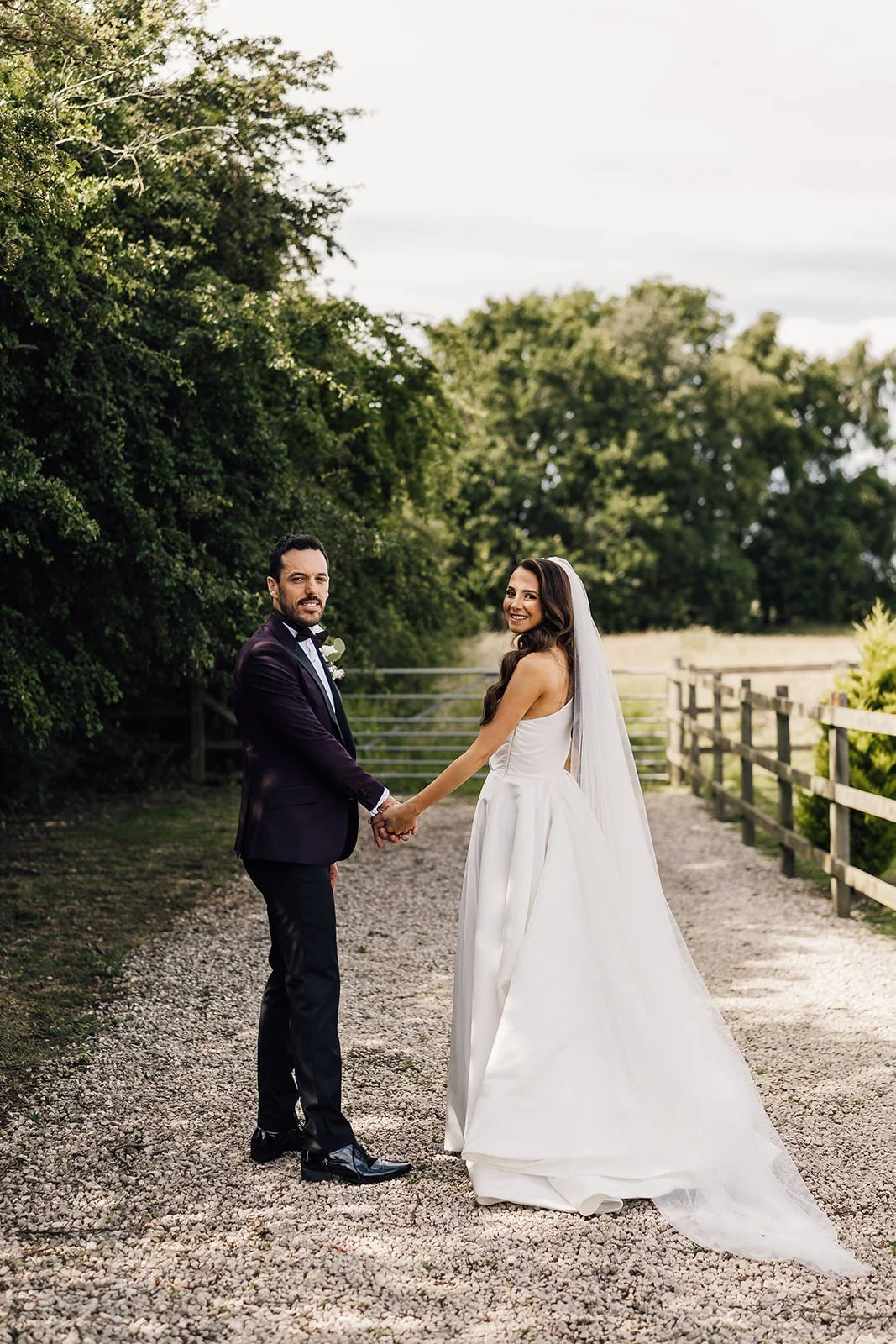 Becky walking with her dad beside the barn before the ceremony