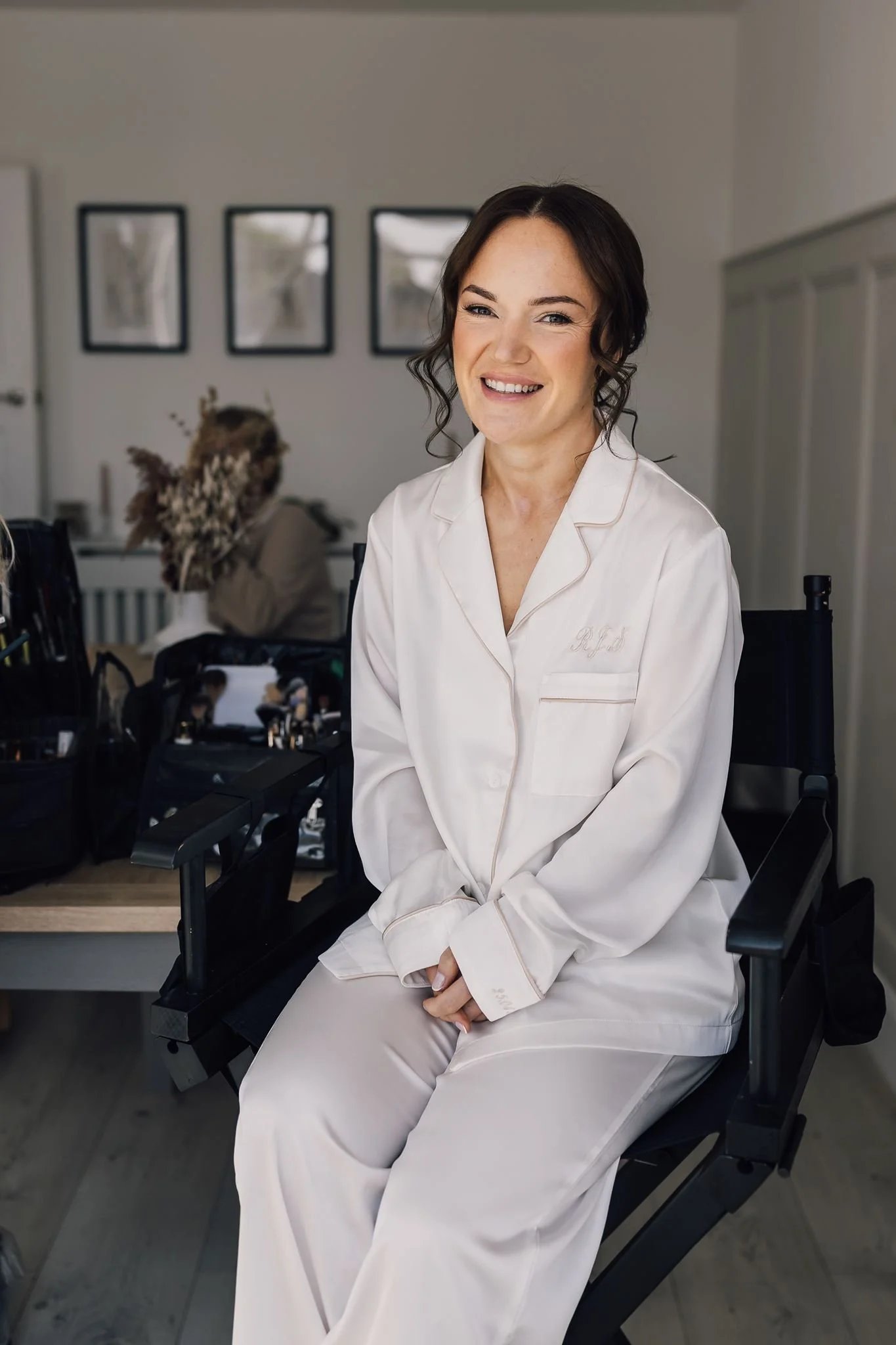 Rachel smiling in her dressing gown while getting ready