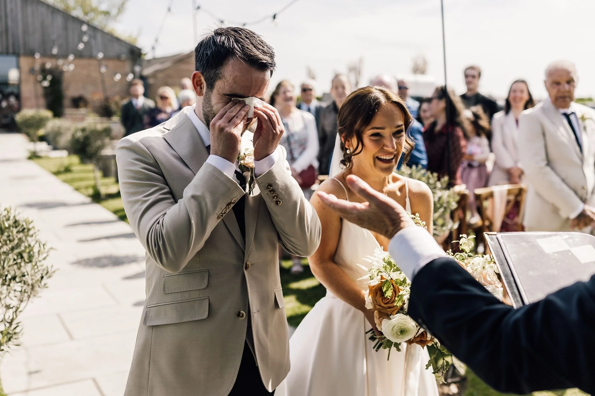 Harry wiping his eye as Rachel joins him for the outdoor ceremony