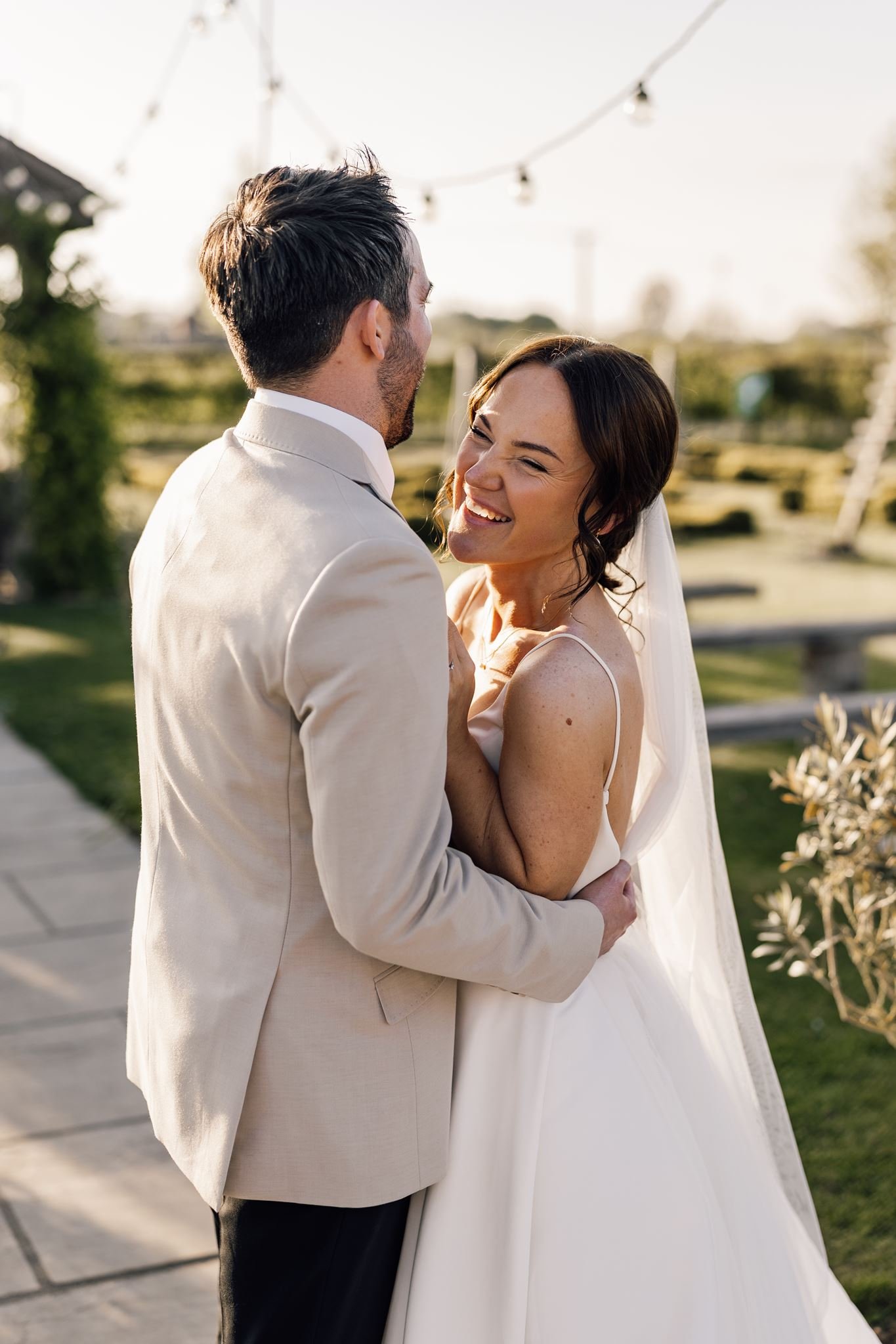 Rachel laughing with Harry during their garden portraits