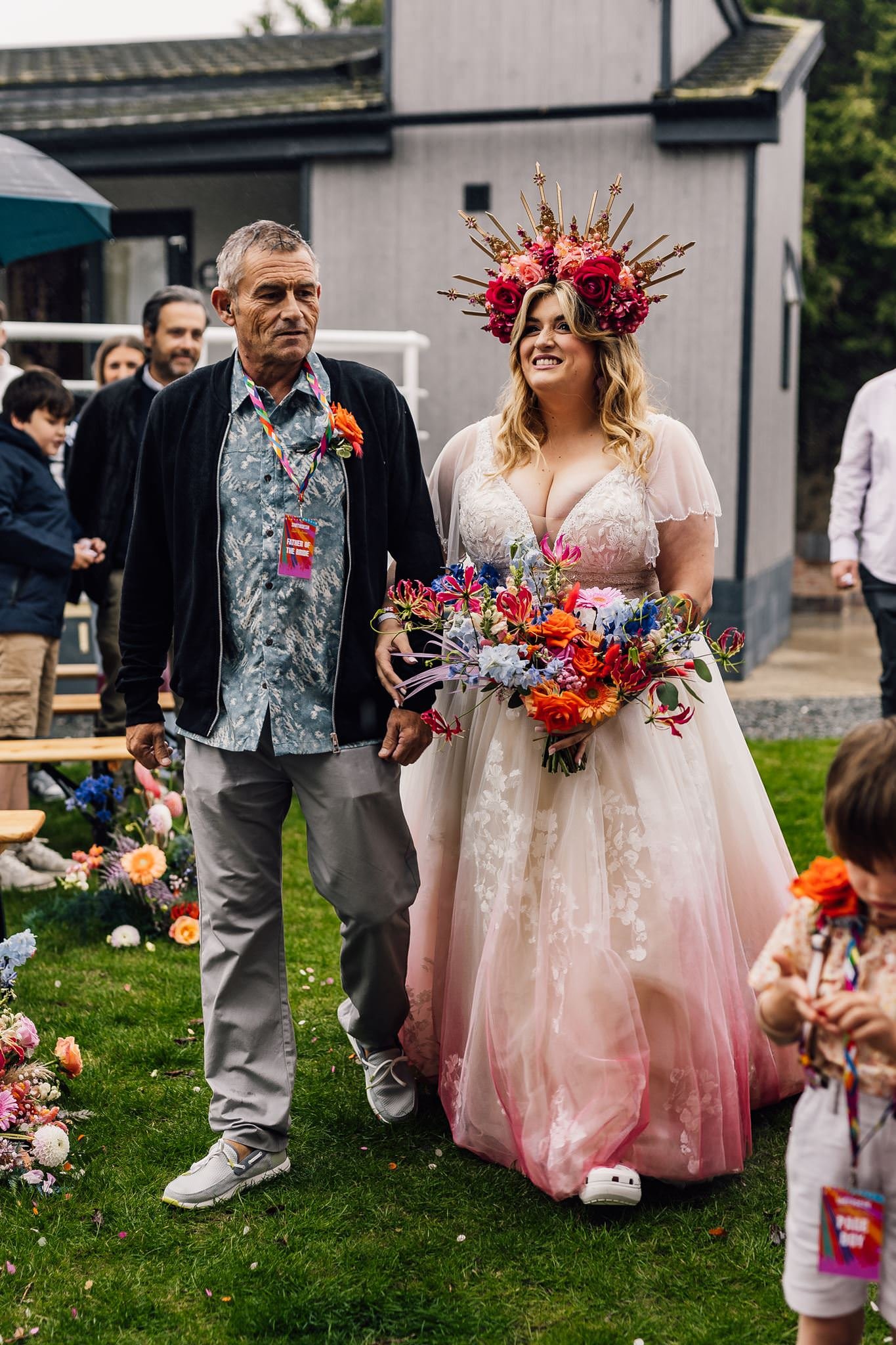 Chloe walking towards the outdoor ceremony with a guest