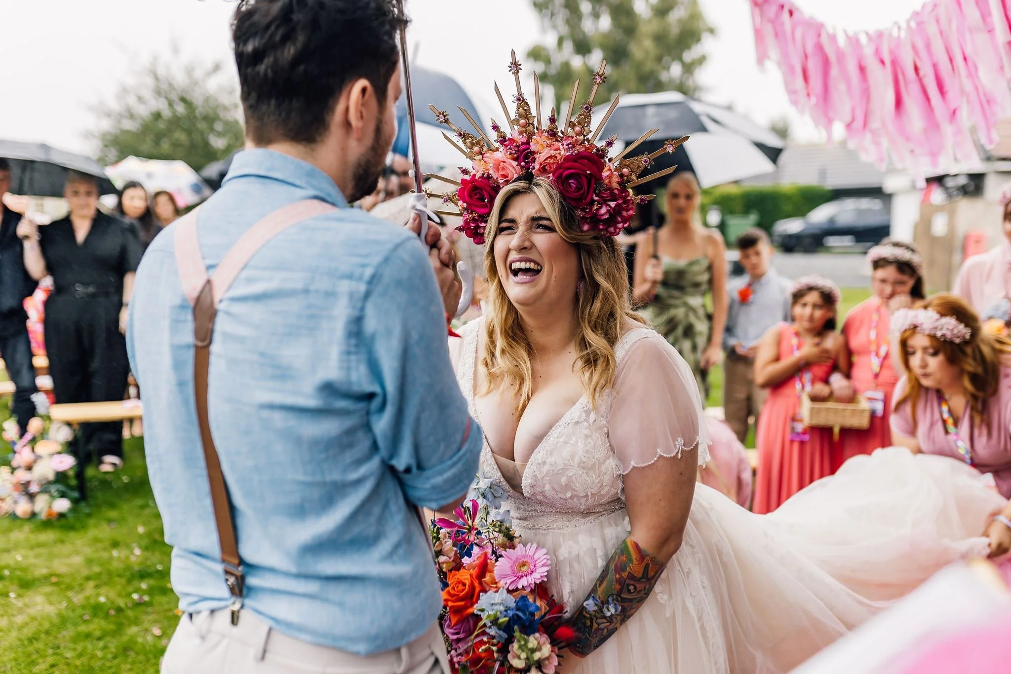 Chloe laughing as she faces Aaron during their ceremony