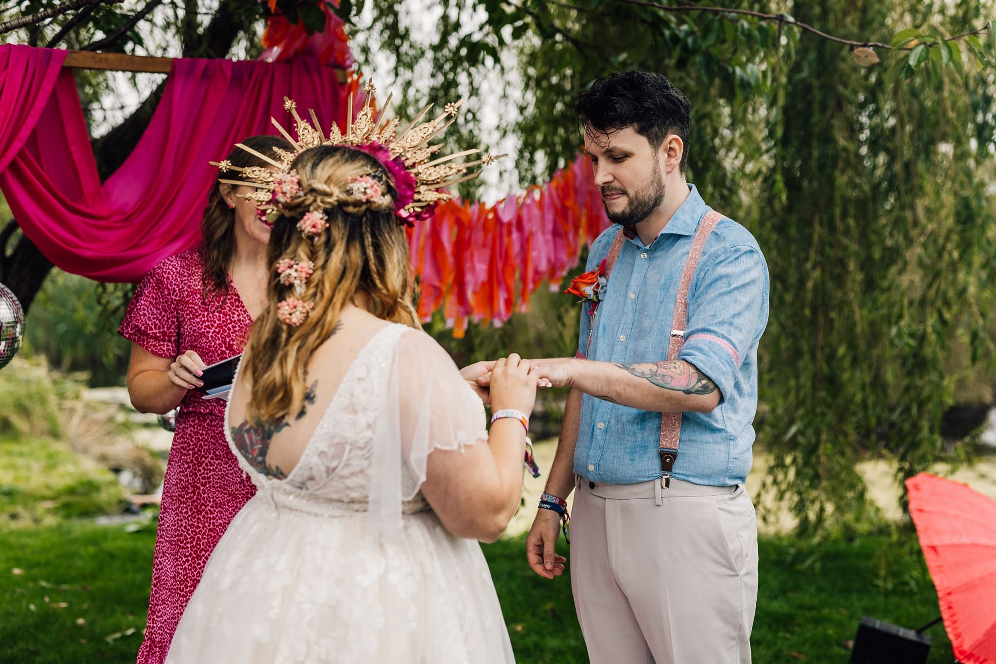 Aaron placing a wedding ring on Chloe’s finger
