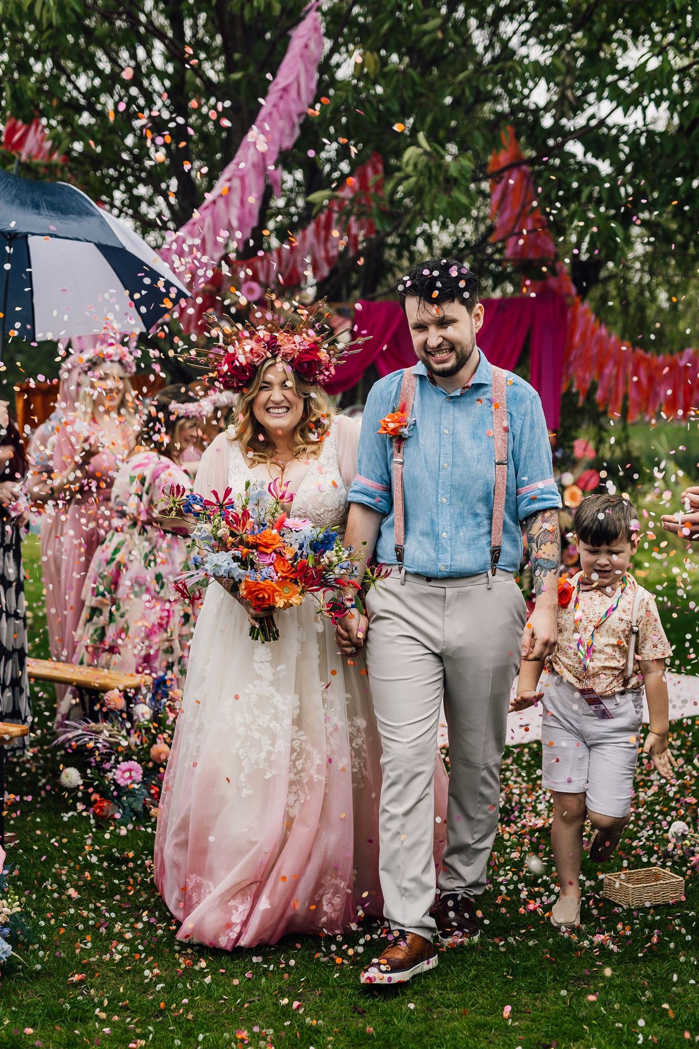Chloe and Aaron walking back along the aisle together