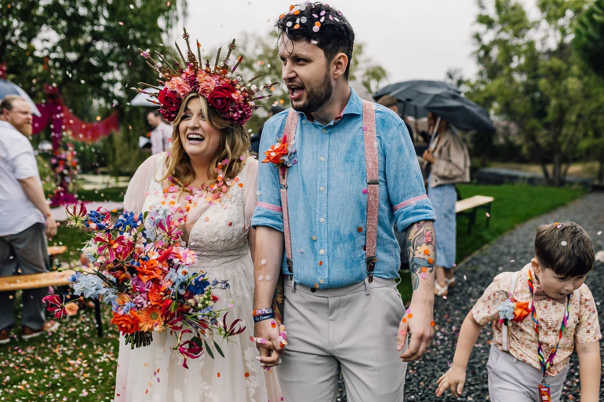 Confetti falling around Chloe and Aaron after their outdoor ceremony