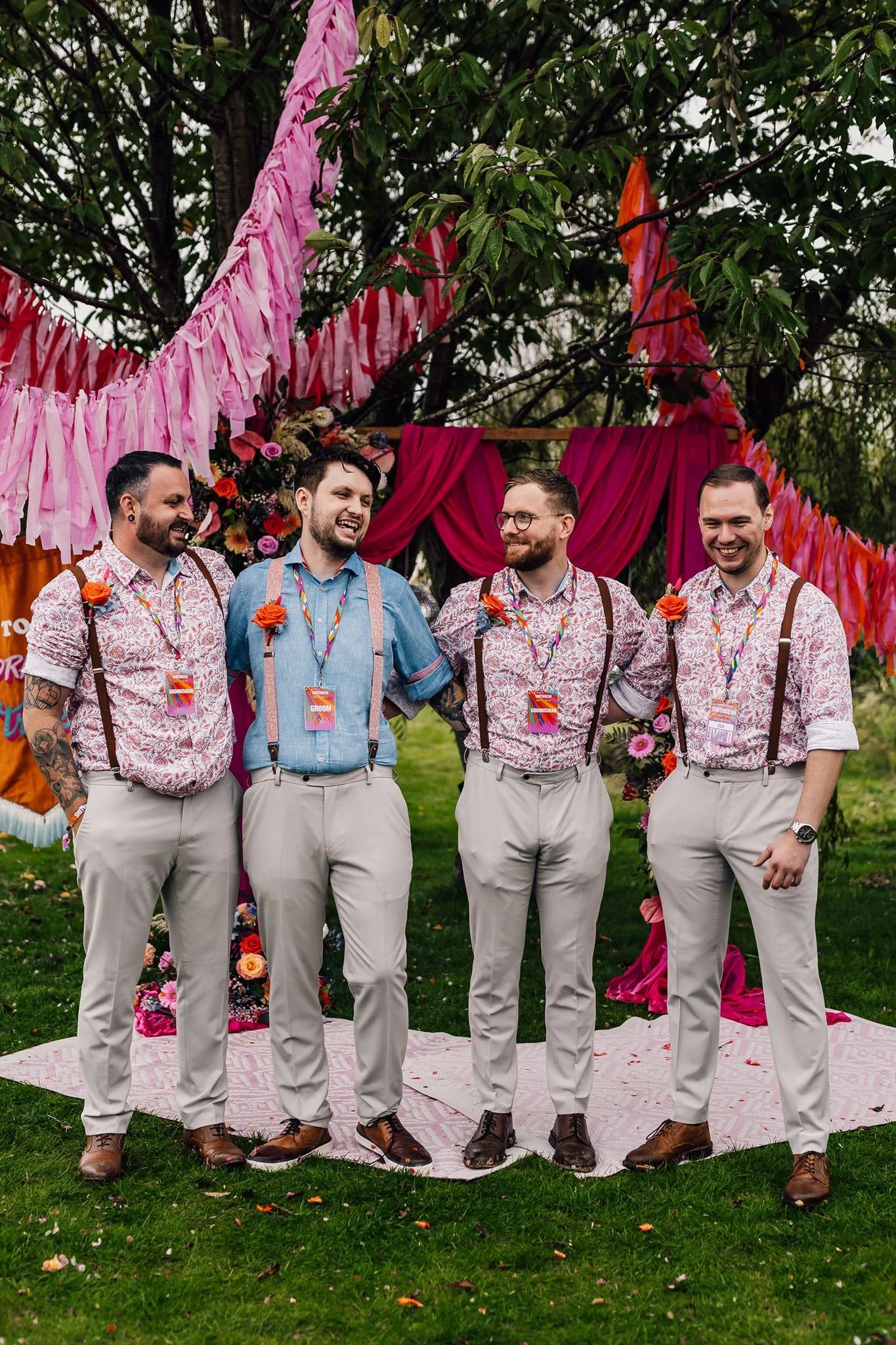 Aaron and his wedding party in colourful braces and buttonholes