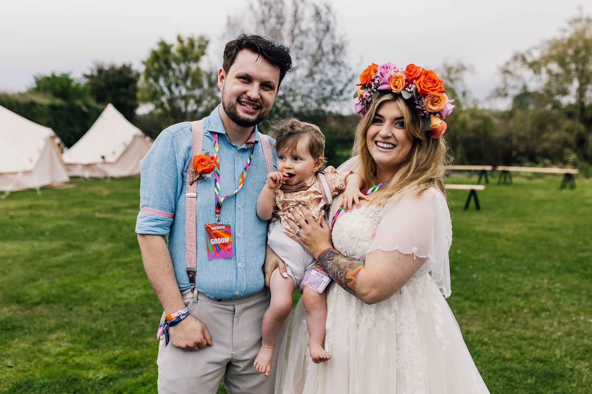 Chloe and Aaron with a young guest outdoors