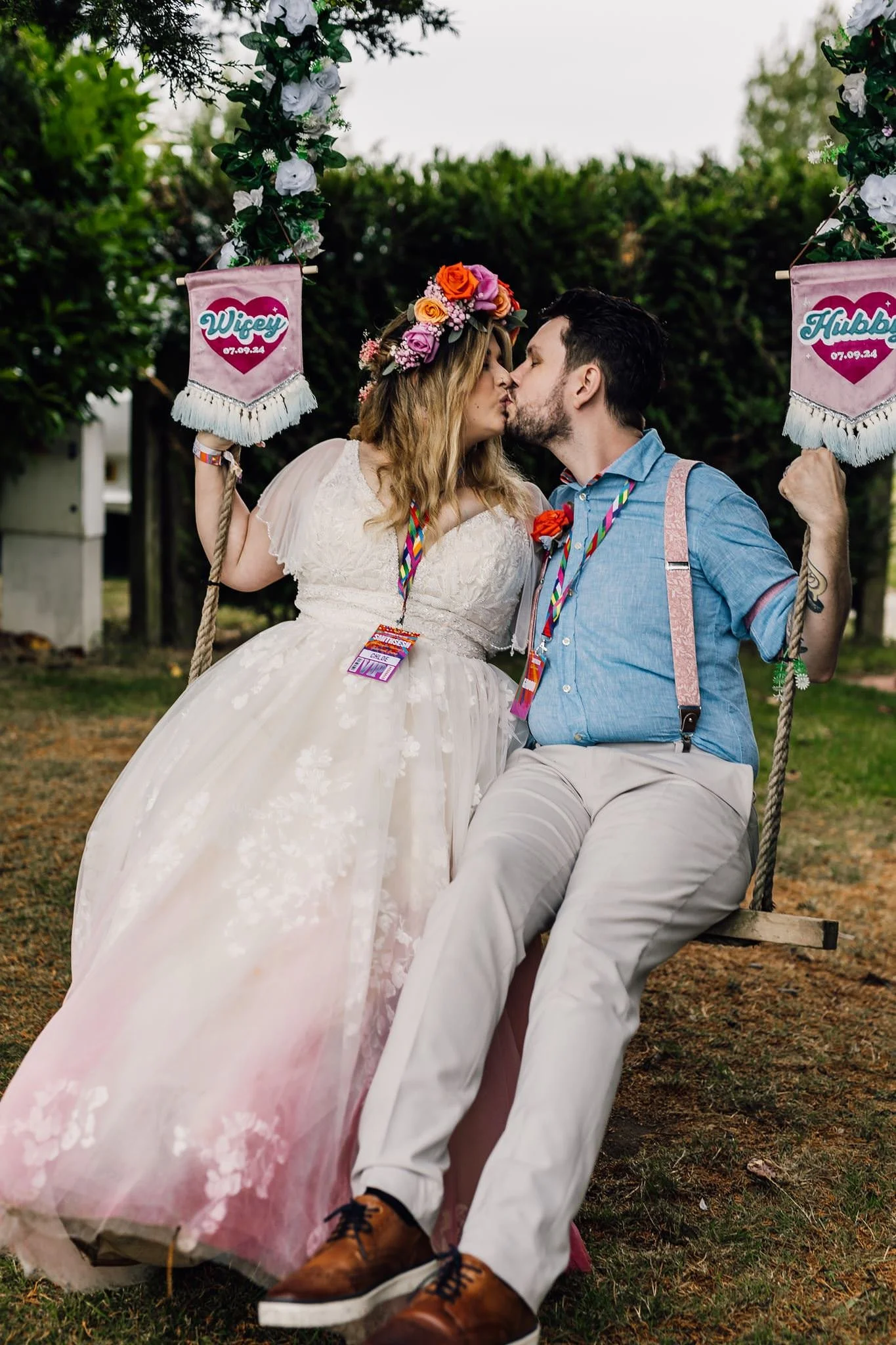 Chloe and Aaron kissing on a wooden bench