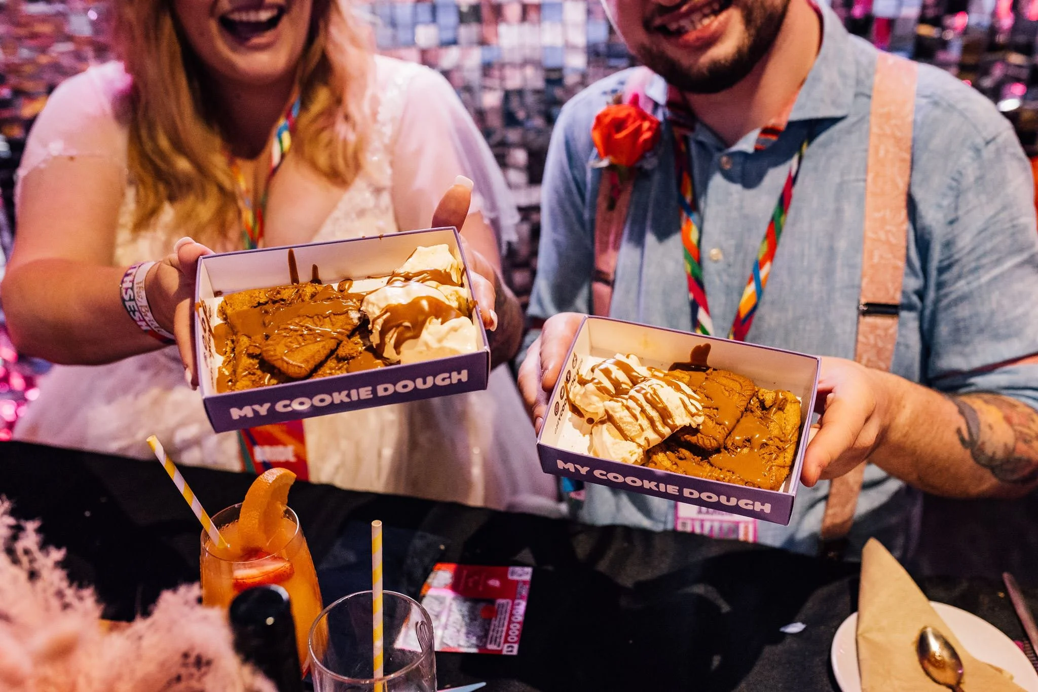 Chloe and Aaron holding boxes of wedding street food