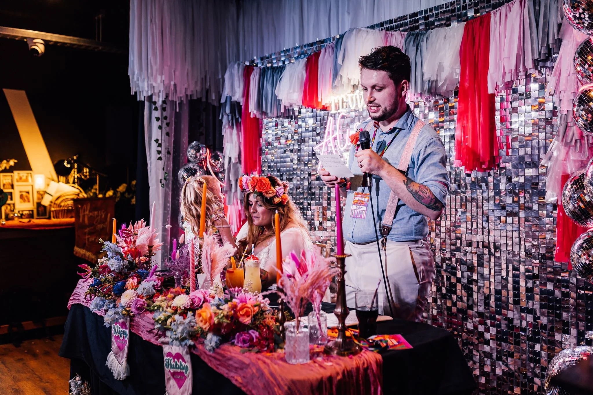 Aaron giving his wedding speech at the colourful top table