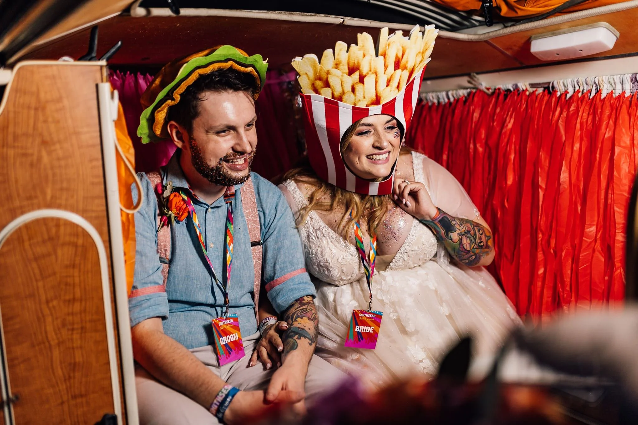 Chloe and Aaron wearing playful props in the VW photobooth